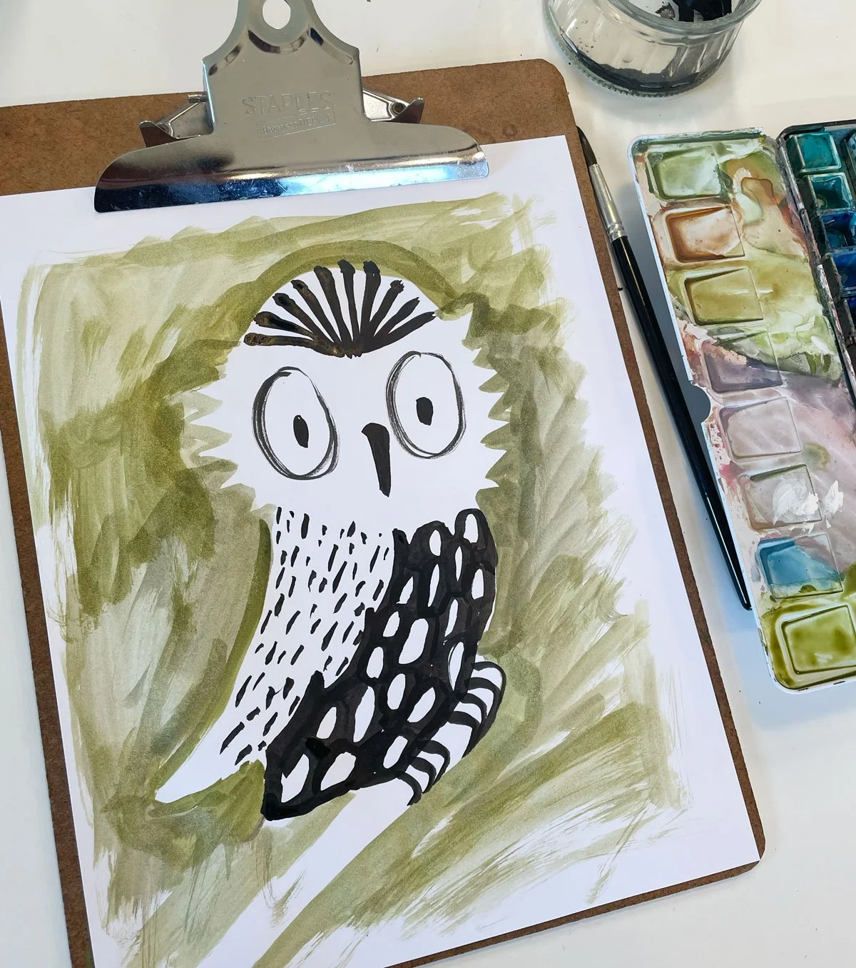 art project of a black and white owl in ink and watercolours