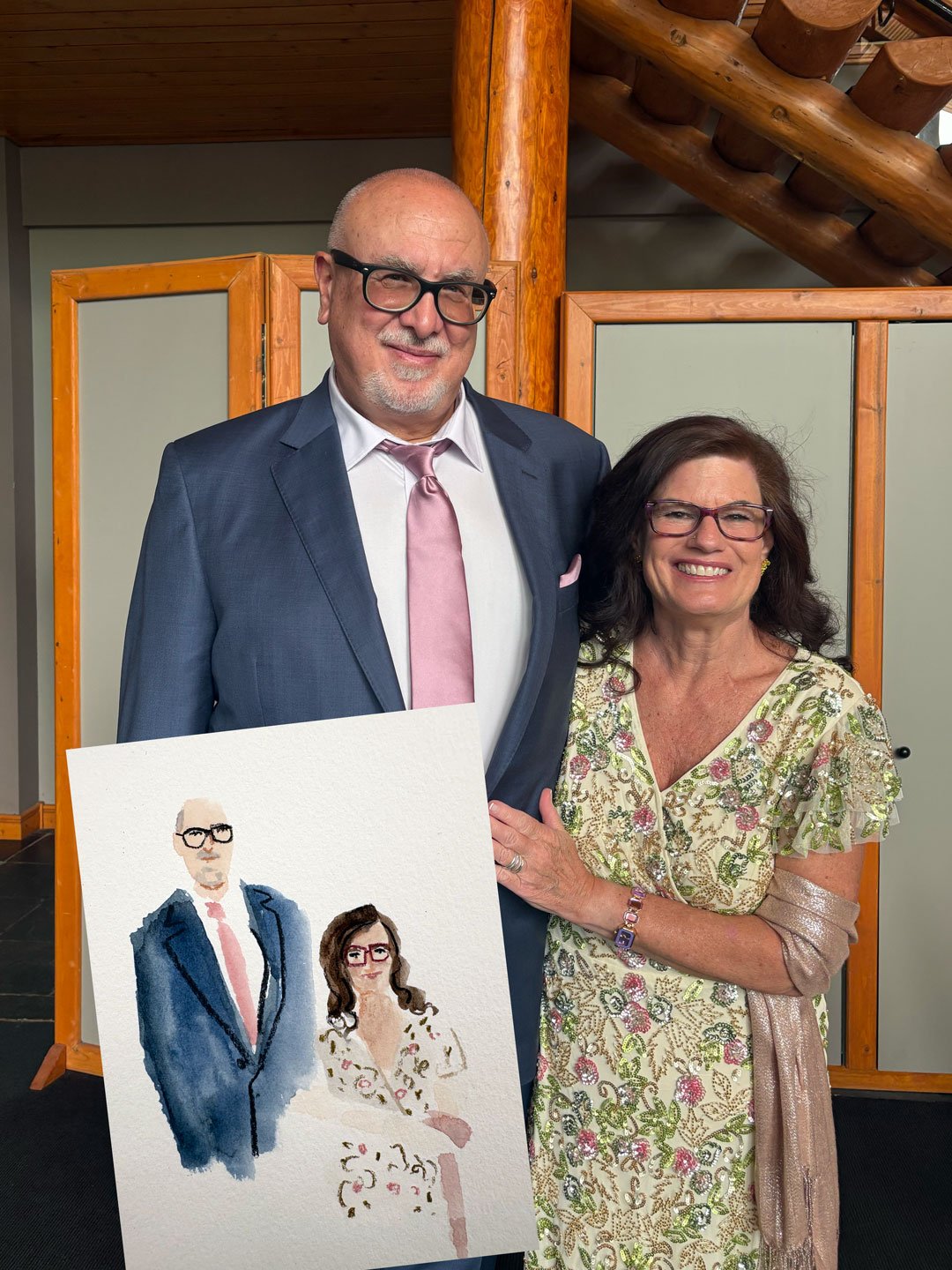 A couple had their portrait painted by Brina Schenk at Lizard Creek Lodge for a Fernie wedding