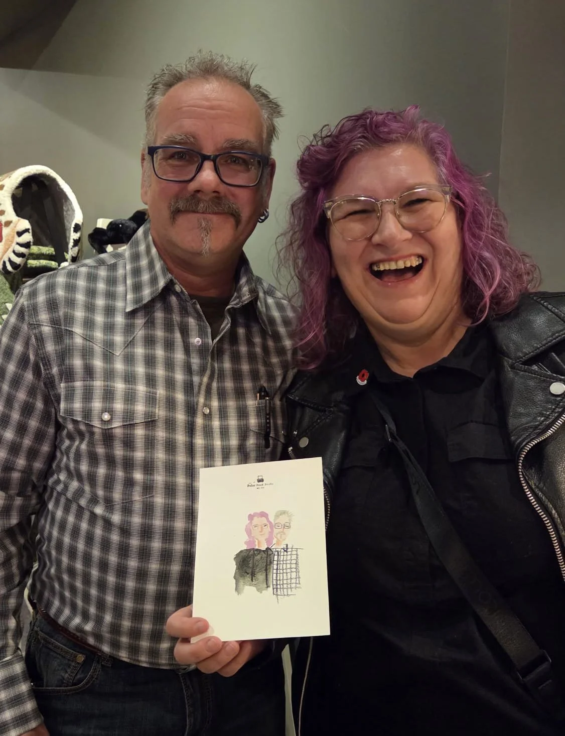 live portrait painter at Polar Peak Book Store downtown Fernie for grand reopening event by Brina Schenk