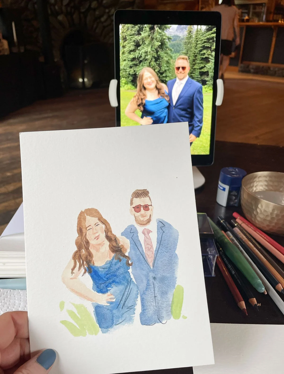 Live guest portrait painting at a wedding in Fernie, BC, Canada at Island Lake Lodge
