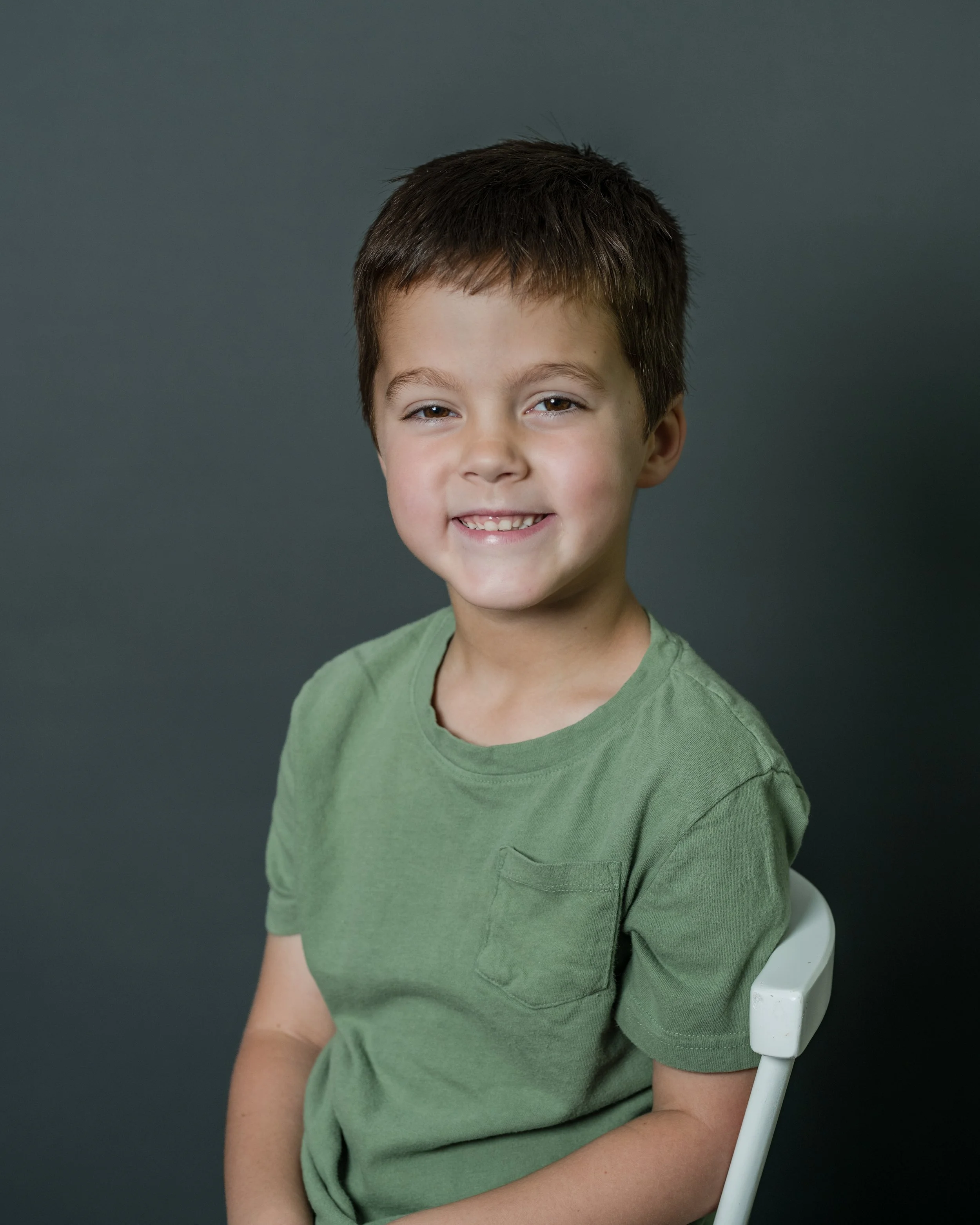 Child enjoying a relaxed school portrait session with a school photographer in NC