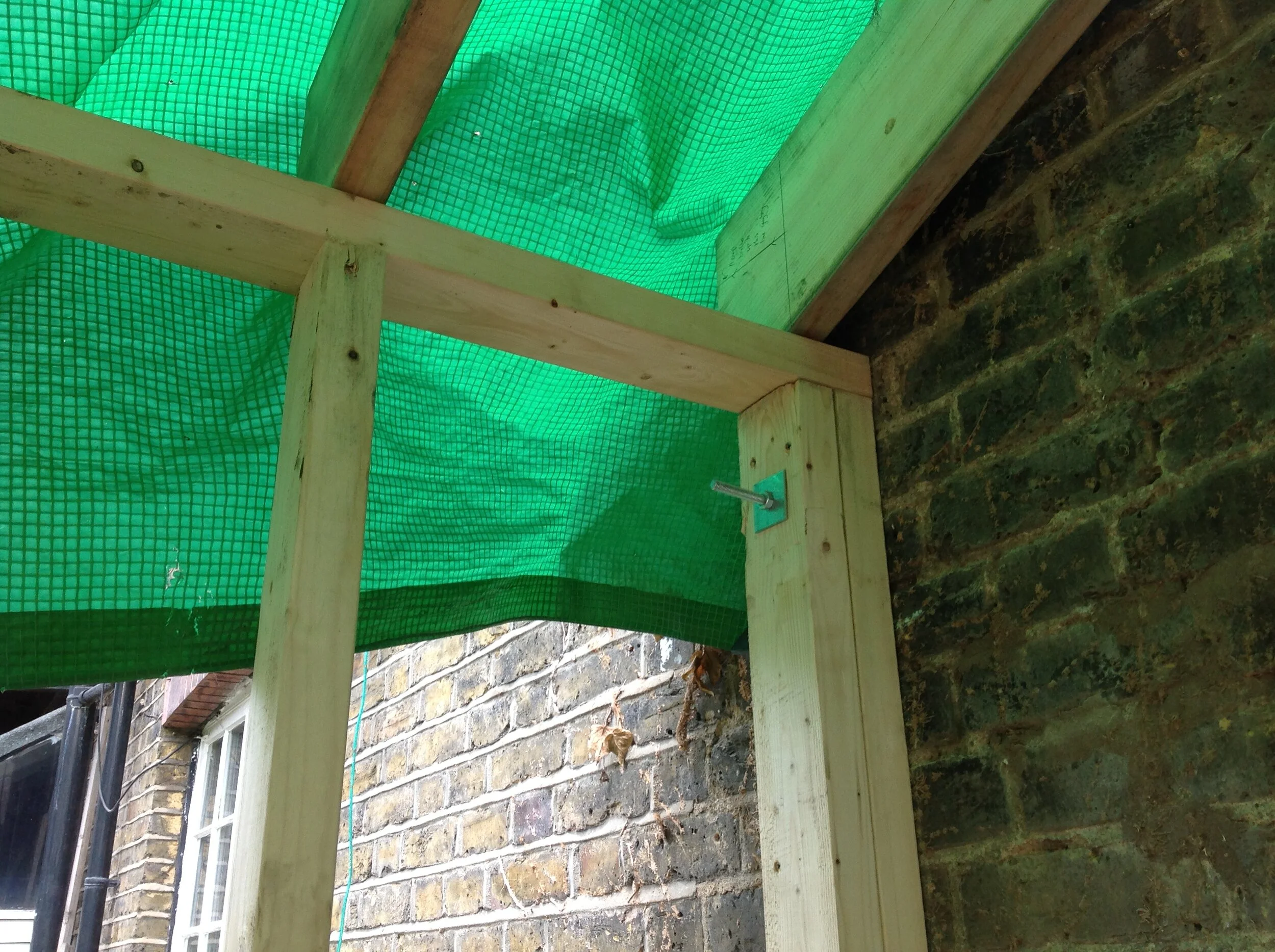 the frame is bolted to the masonry with resin anchors