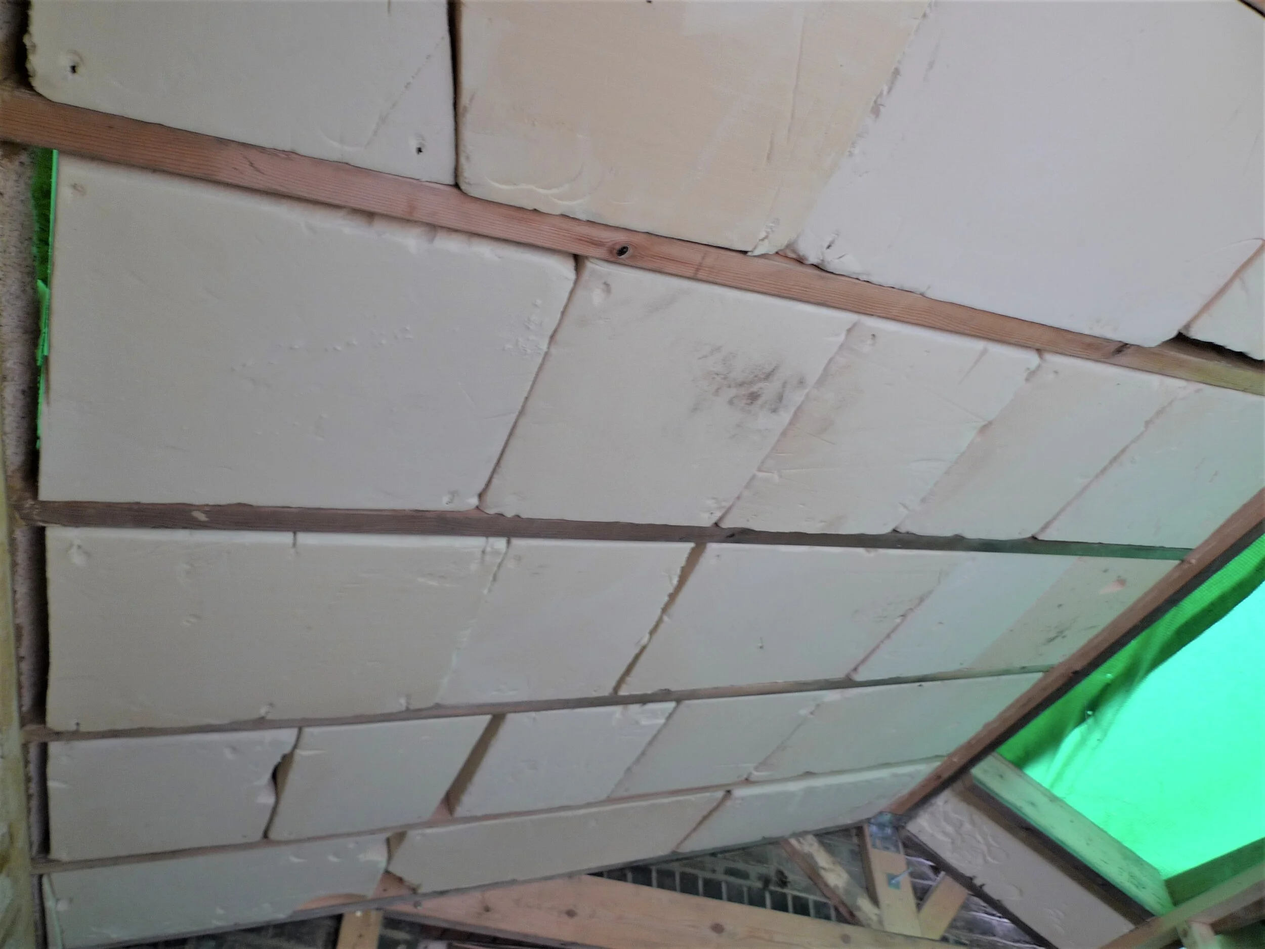 between the rafters was insulated with foam insulation out of a skip from a build down the road