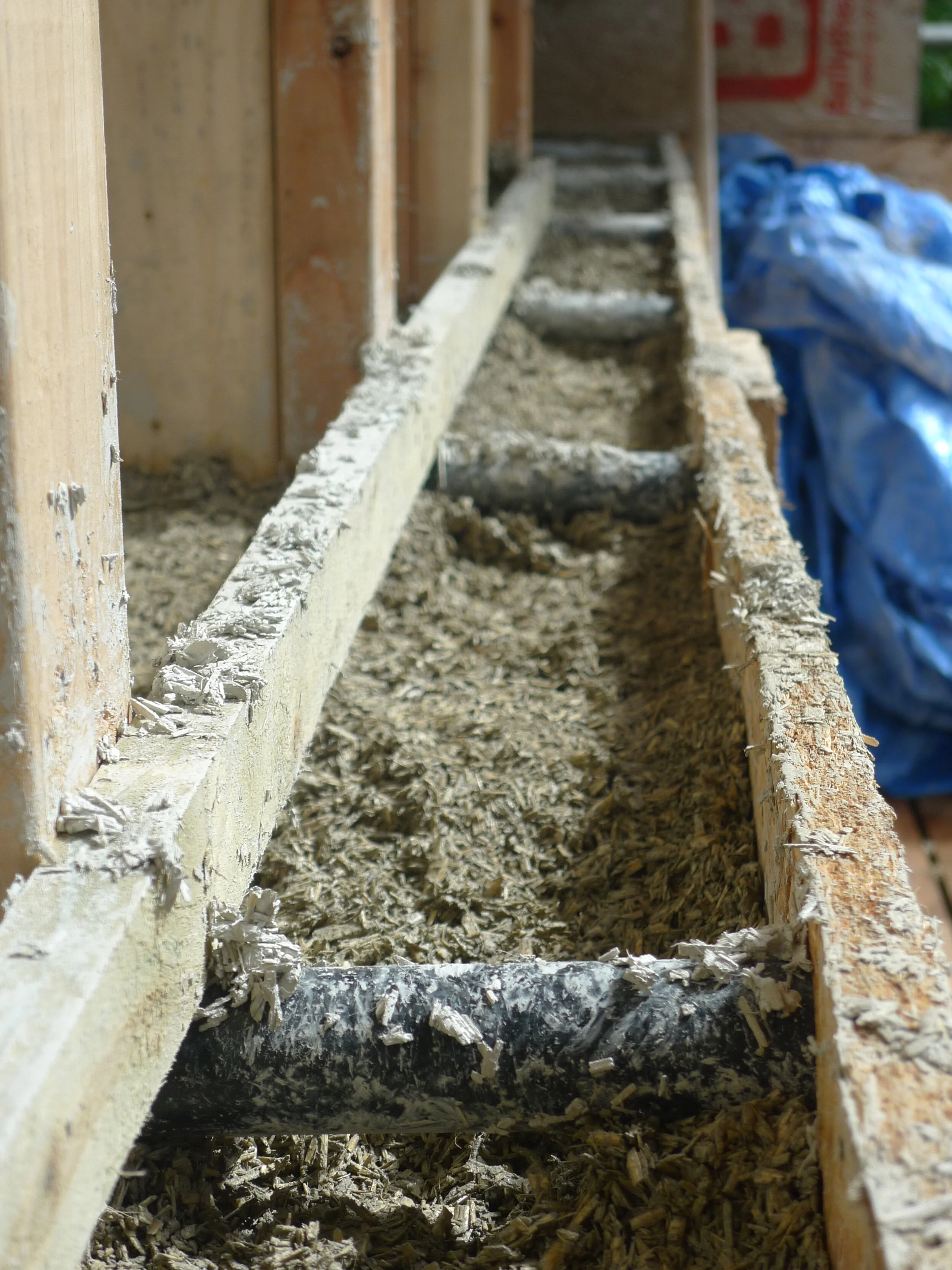 batten fixed to stud to give the hempcrete a key and pipe spacer for shuttering