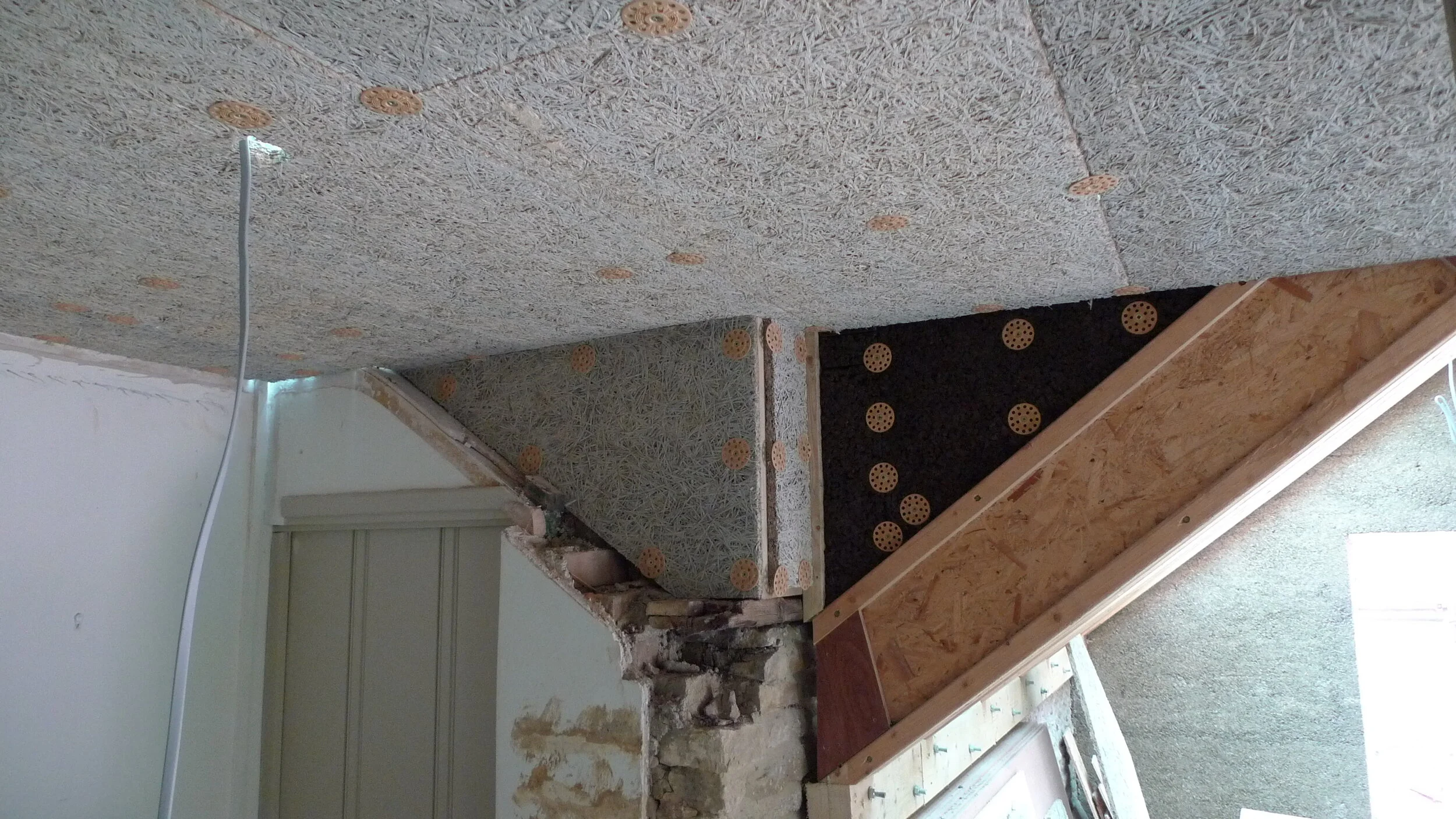 There is a flat roof linking old house and the extension which creates a nice large landing area on the first floor. The dark board is cork board which was used for lots of tricky areas.