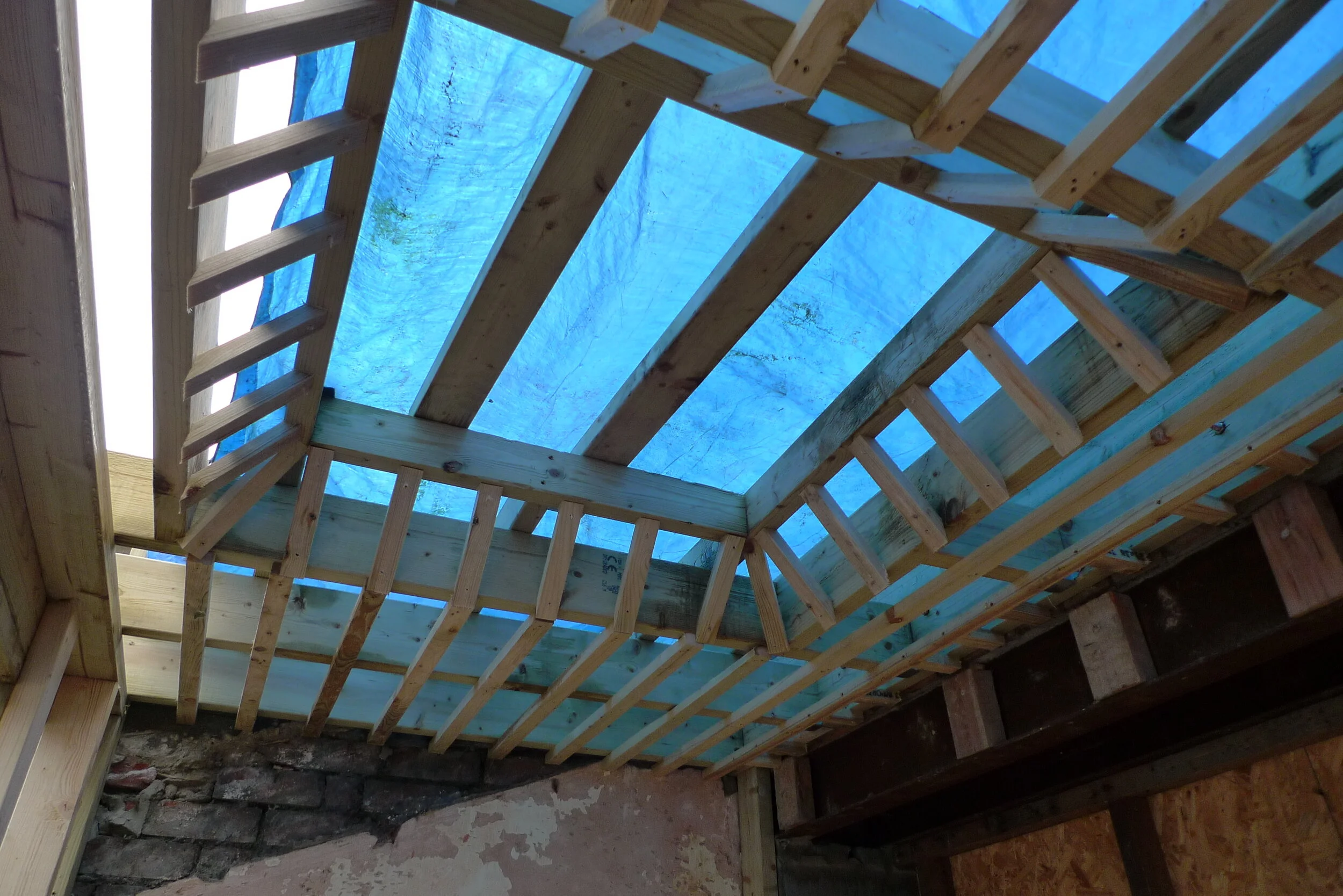 The battens are to support the hempcrete ceiling structure around the skylight.