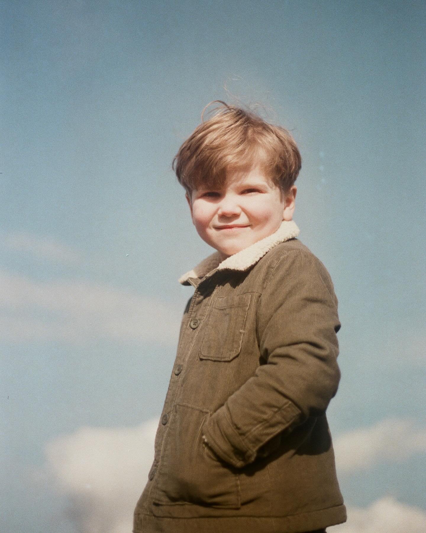 Arthur and blue skies on film with the cutest smirk and scrunched up nose.