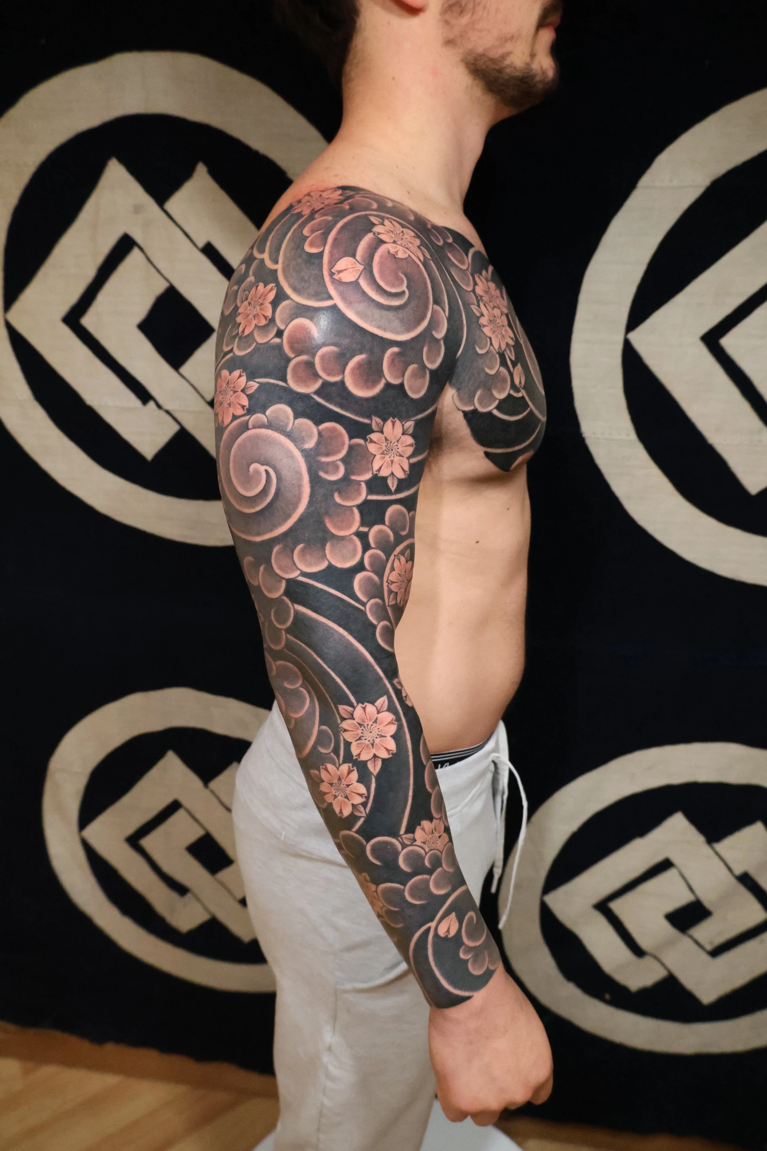Japanese inspired blackwork men's tattoo sleeve by Austin tattoo artist Jason Metka