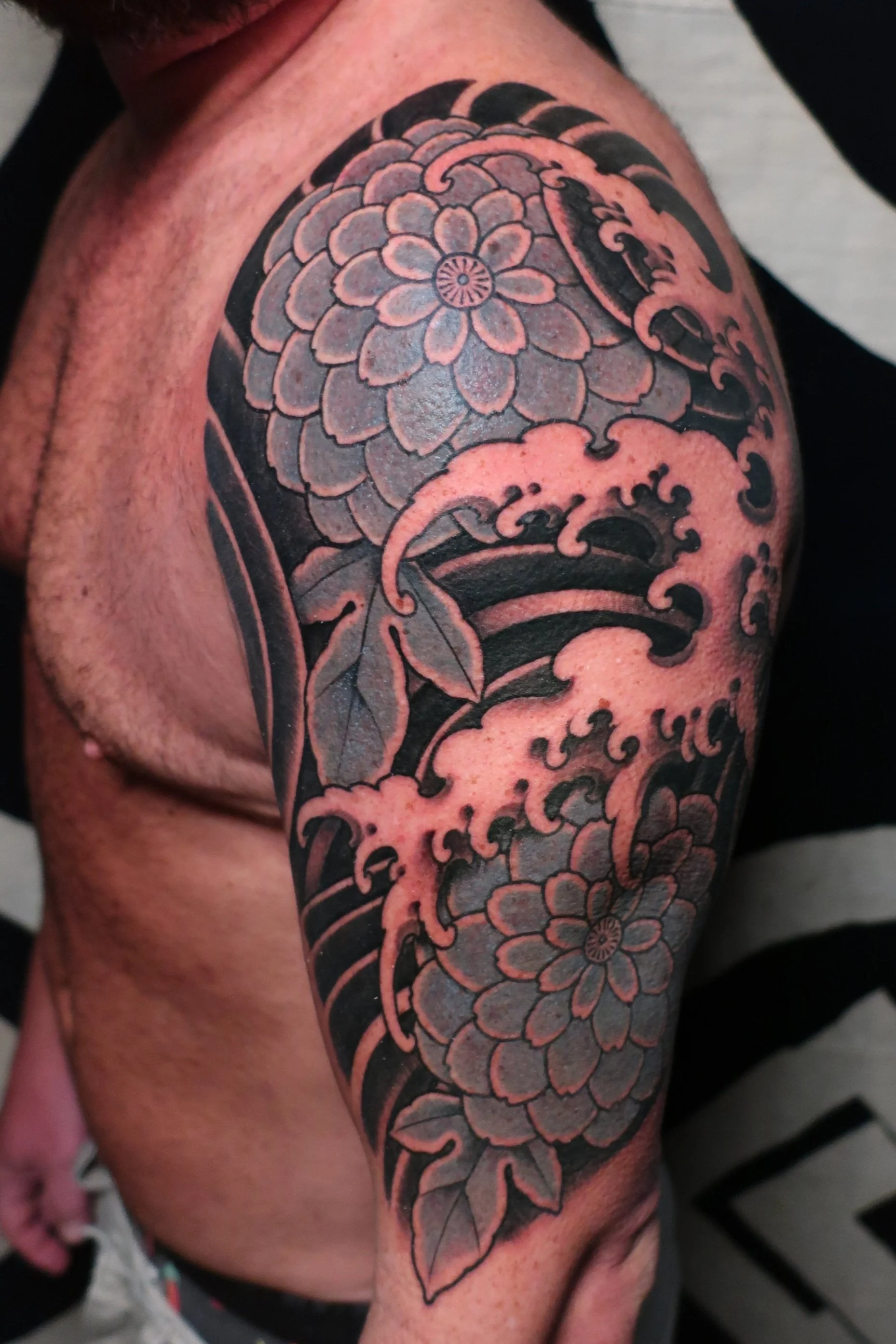 Chrysanthemum Half Sleeve Tattoo in blue and black with water