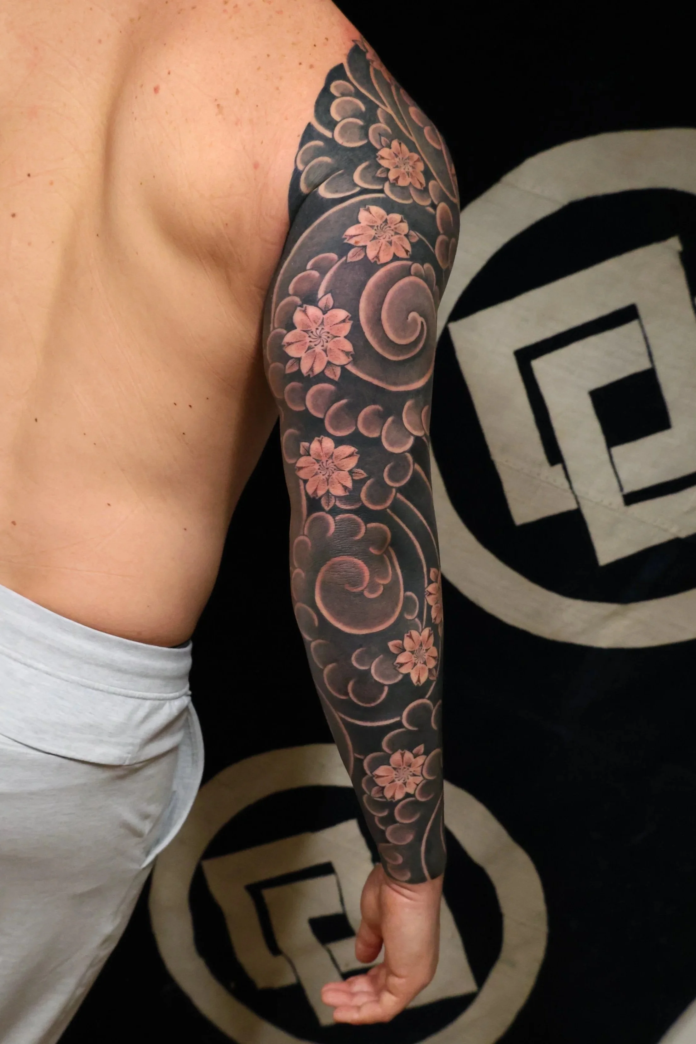 Austin Japanese Tattoo Shop client showing Irezumi blackwork sleeve