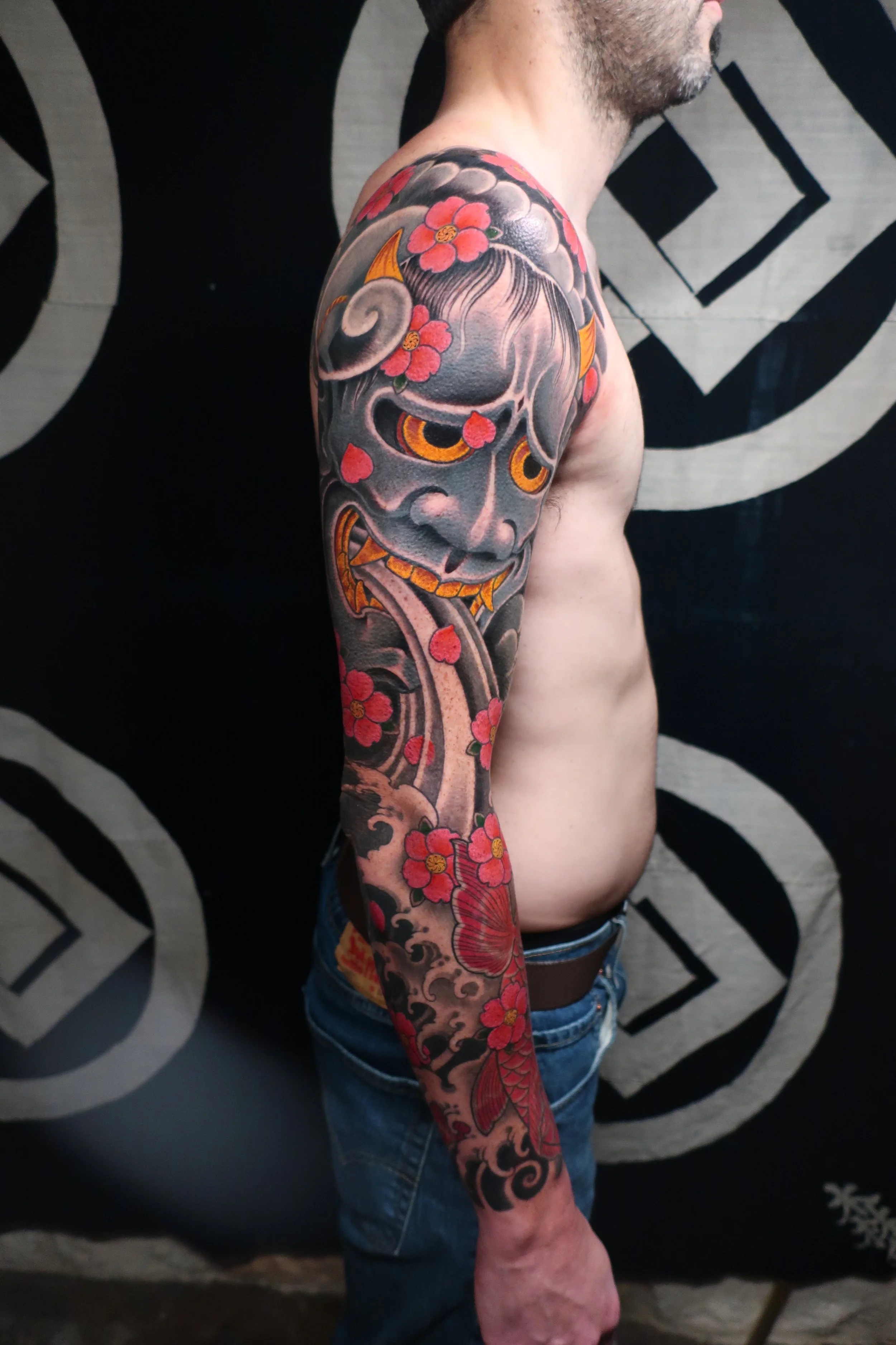 Full coverage tattoo sleeve for men with Hannya mask, koi, water and cherry blossoms