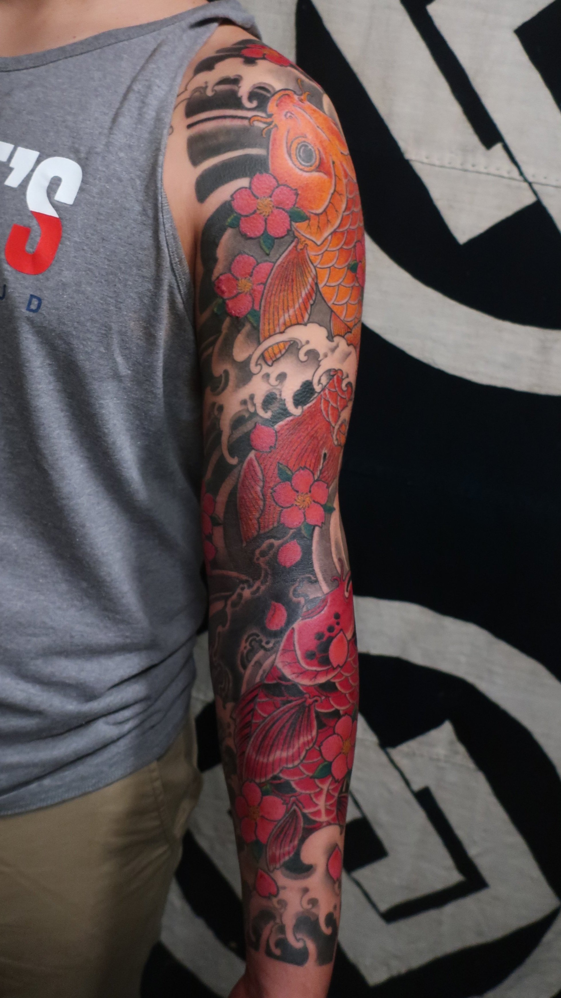 Japanese Koi sleeve with wind bars, water and sakura blossoms