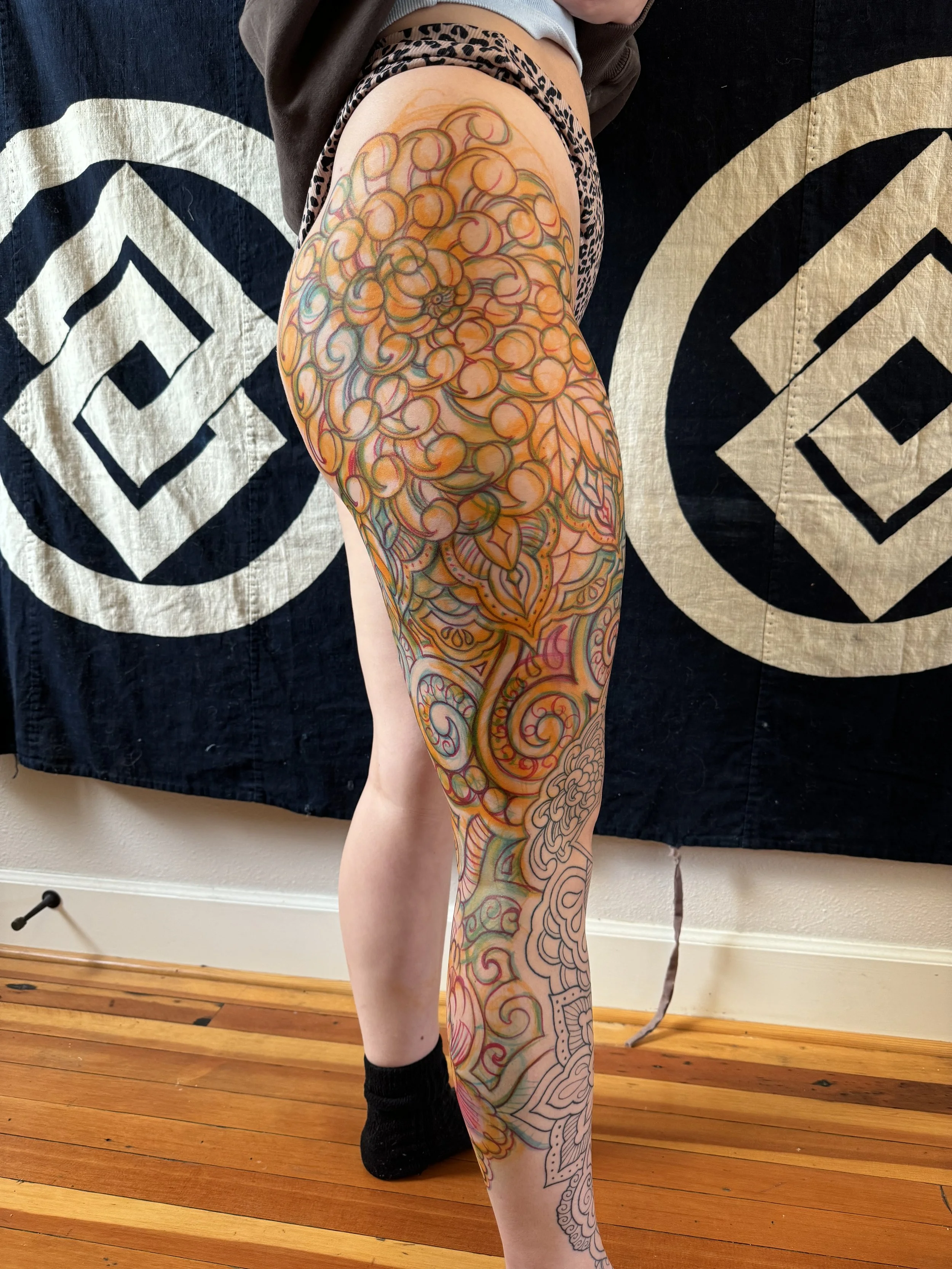 Freehand leg drawn on by tattoo artist before starting tattoo session. 
