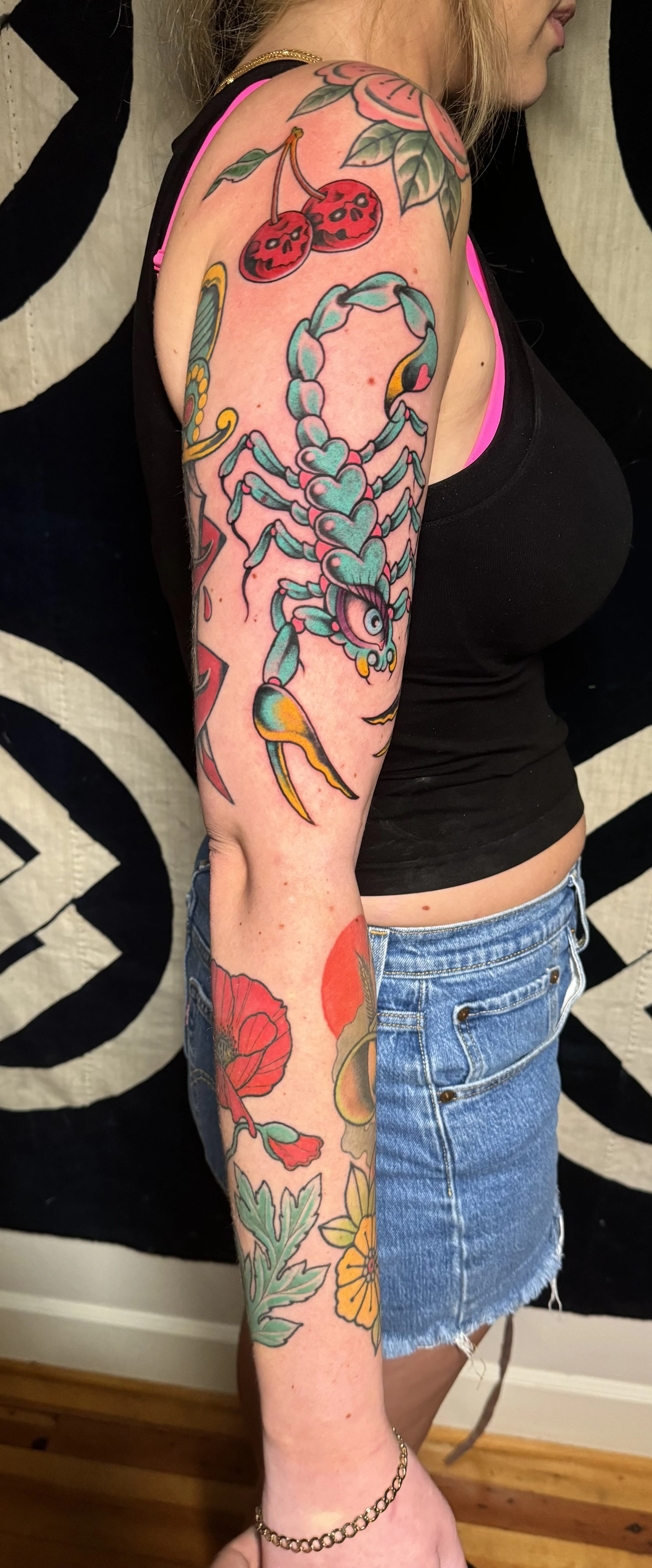 American Traditional bold colorful patchwork sleeve by Austin Texas tattoo artist