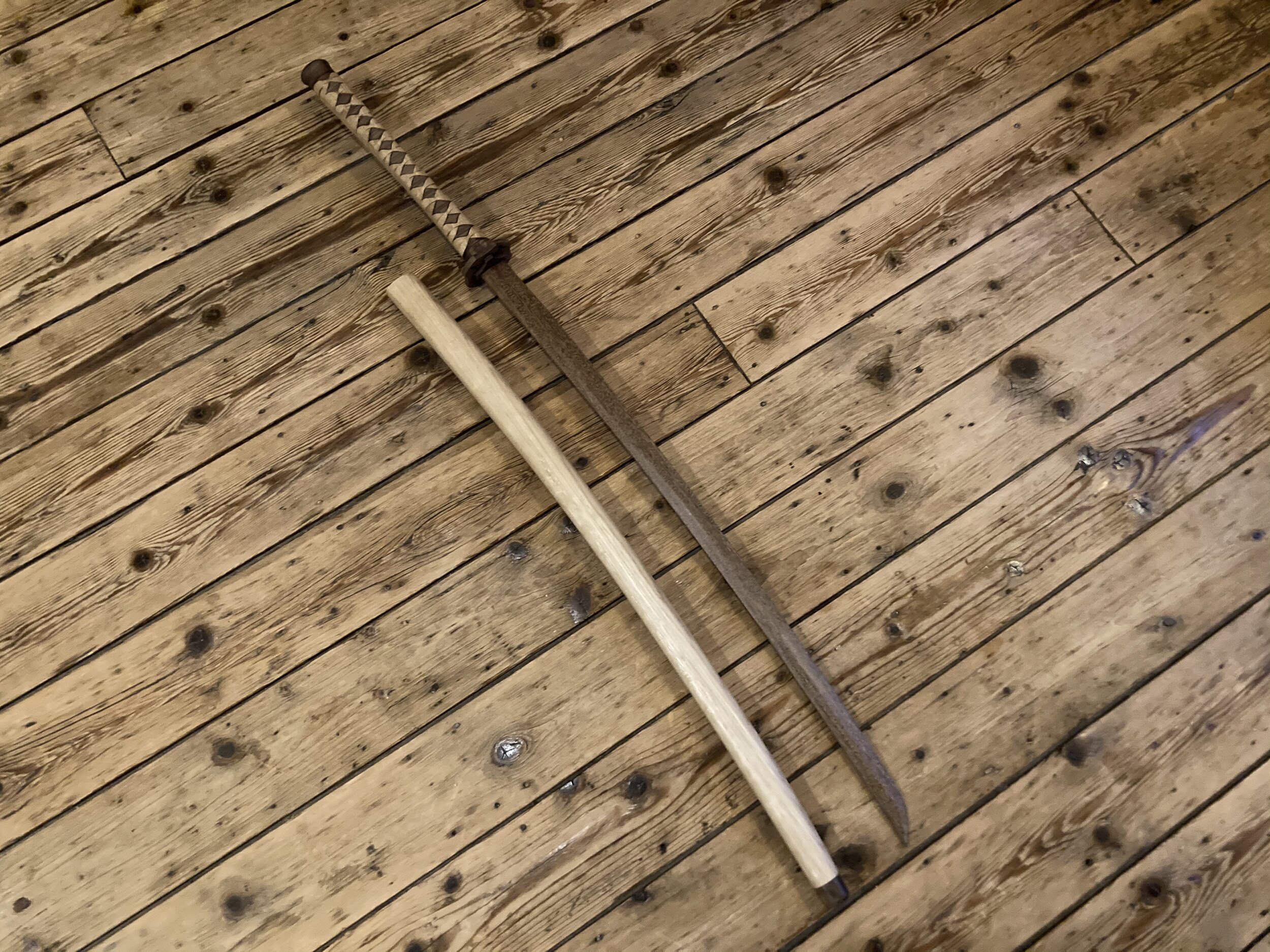Side by side, sword and sheath. The blade is Meranti. It's a lot harder then the Walnut, but doesn't have too much of a color difference. The sheath is in Oak.