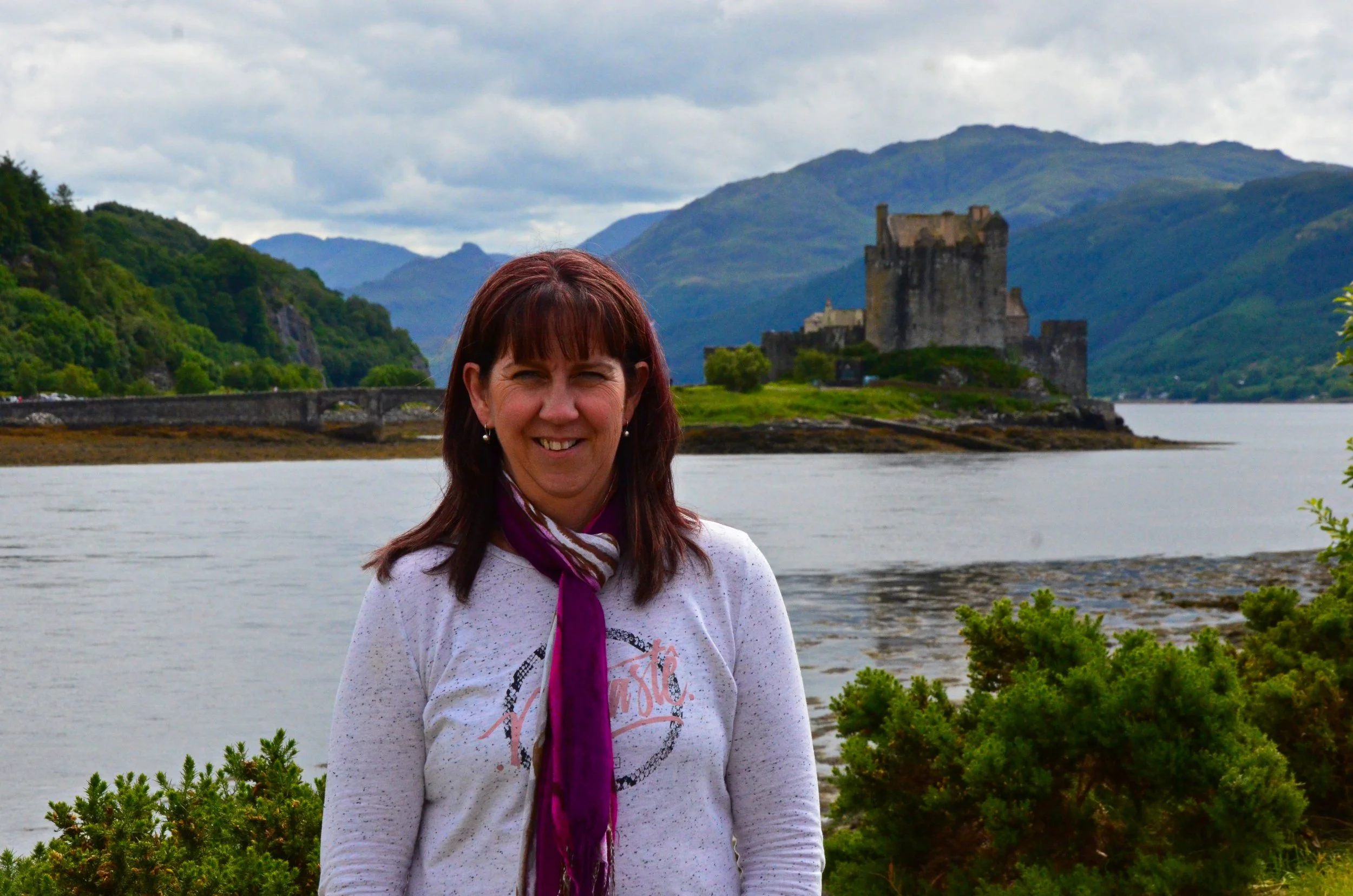 Max at Eilean Donan Castle in Scotland, the first castle she ever visited and an early inspiration behind Plantagenet Discoveries.