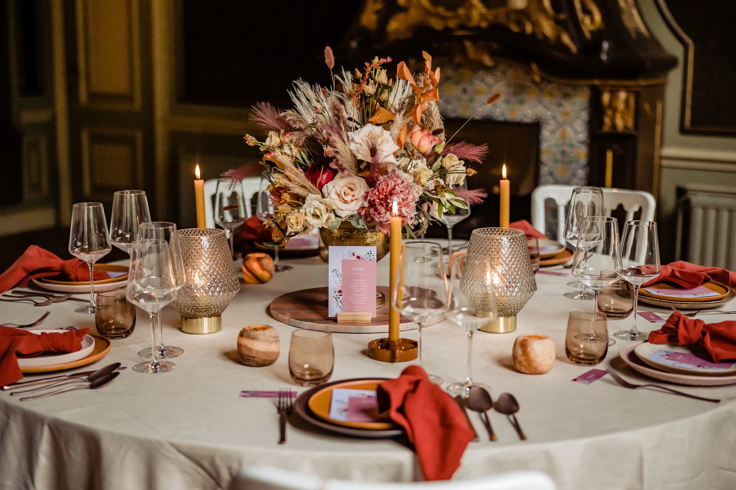 Elegant dining table setup with floral centerpiece and candles