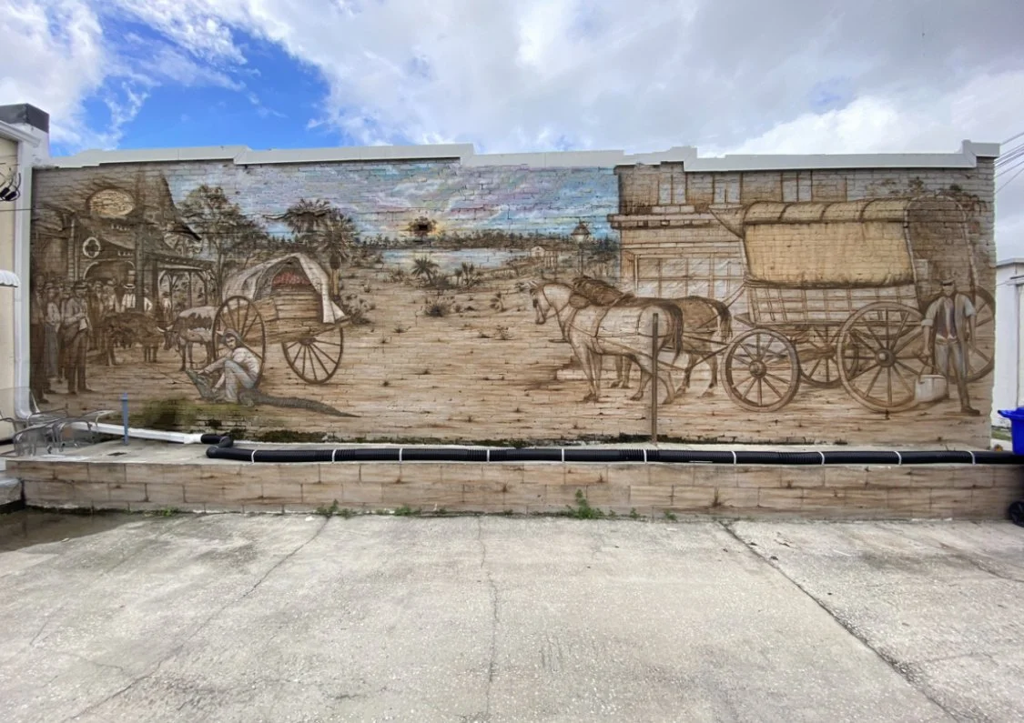 This image is of the echoes of yesterday mural on broadway Kissimmee Florida. It depicts broadway in the past