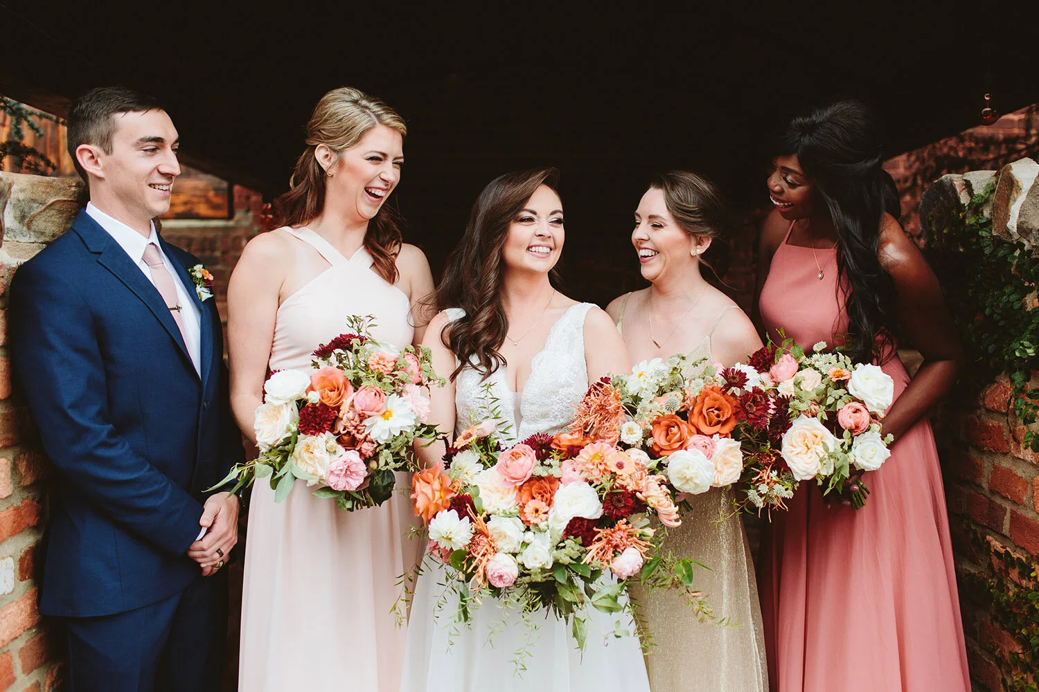 Penny_Bride_Bridesmaids_Laughing_With_Bouquets.jpg
