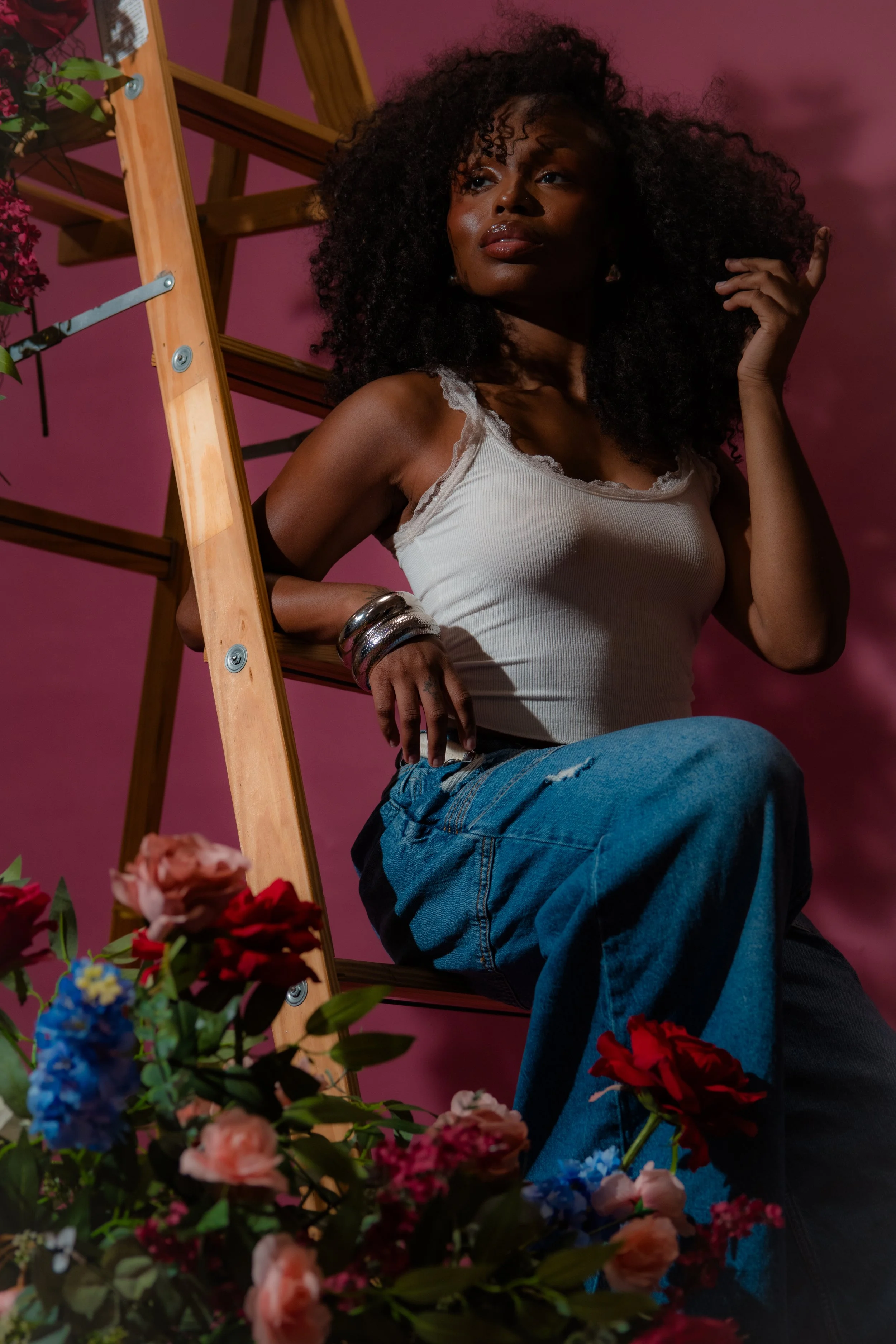 black women on wooden ladder.jpg