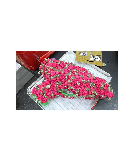 Triggered: "This Is Not A Toy," Assemblage: Silk Roses on toy water gun