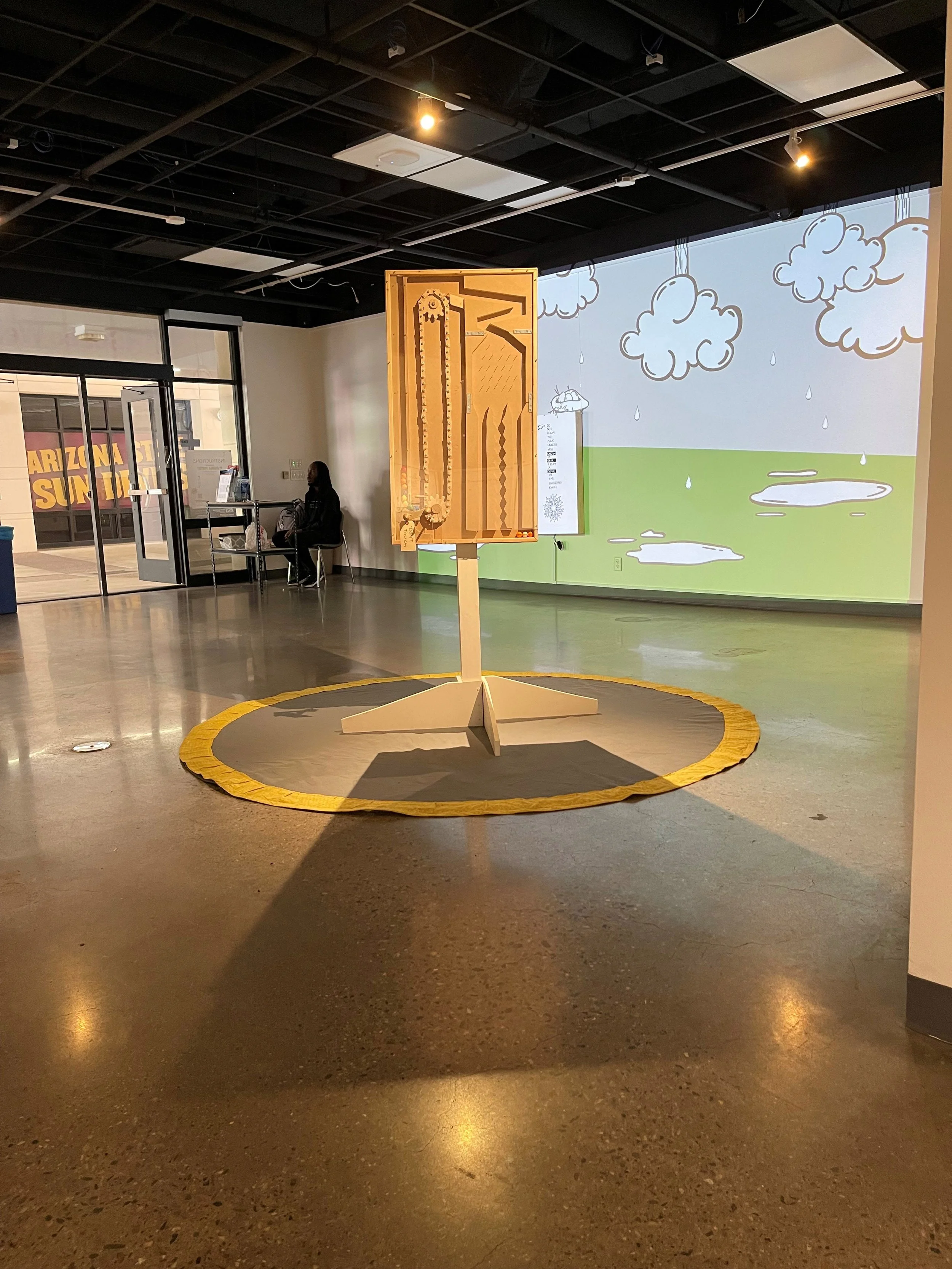 STOP BEHIND YELLOW LINE, 2023-24, Back, Media: Laser print on fabric, wood, bolts and miscellaneous hardware, gumballs, textiles, Poetry. Factory members: Esi Boulet, Theresa Devine