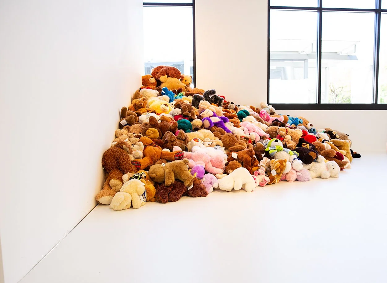 "Untitled Grin and Bear It" (Portrait of Theresa in Phoenix):  Homage to Felix Gonzalez-Torres
Date: 2019
Artist: Theresa Devine
Medium: Abandoned teddy bears, given new life.
Dimensions: Approximately 8’ x 8’ x 8’ (varies with installation)
Origin: 