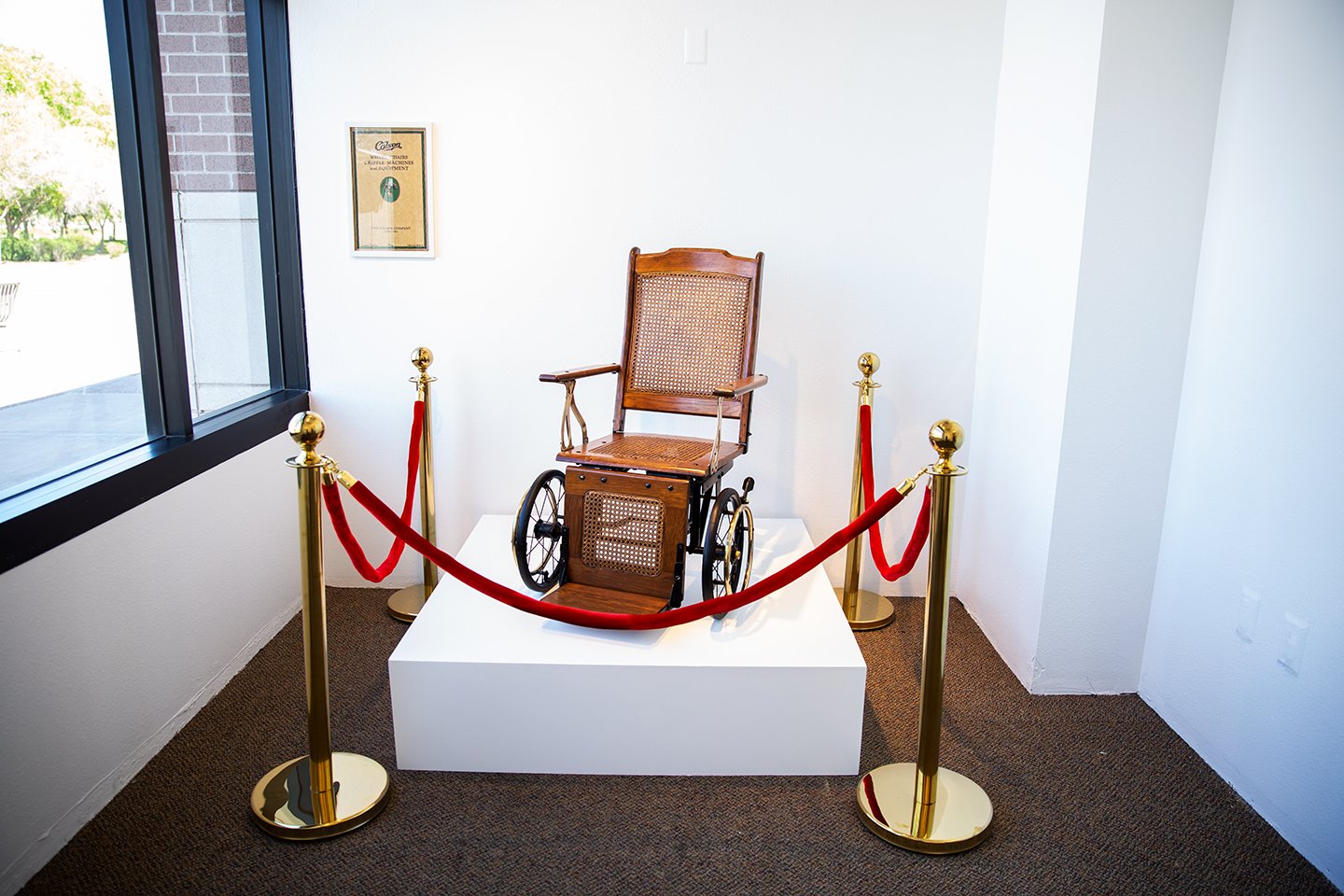 "Dependence"
Date: 2019
Artist: Theresa Devine
Medium: Readymade, Antique Wheelchair, Pedestal, Stanchions and red ropes
Dimensions: Approximately 54” x 54” x 48” (installation)
Origin: United States 
Copyright: © Theresa Devine
Credit Line: Courtesy