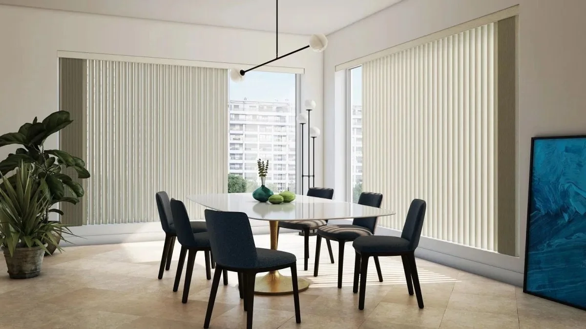 Dining room with a white table, six black chairs, large windows with beige vertical blinds, a potted plant, modern floor lamp, and a large blue abstract painting.