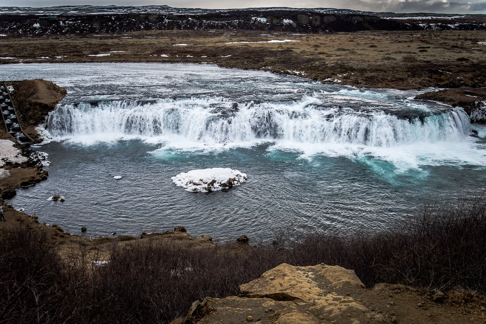 Faxi waterfall flowing across a wide river on Iceland's Golden Circle