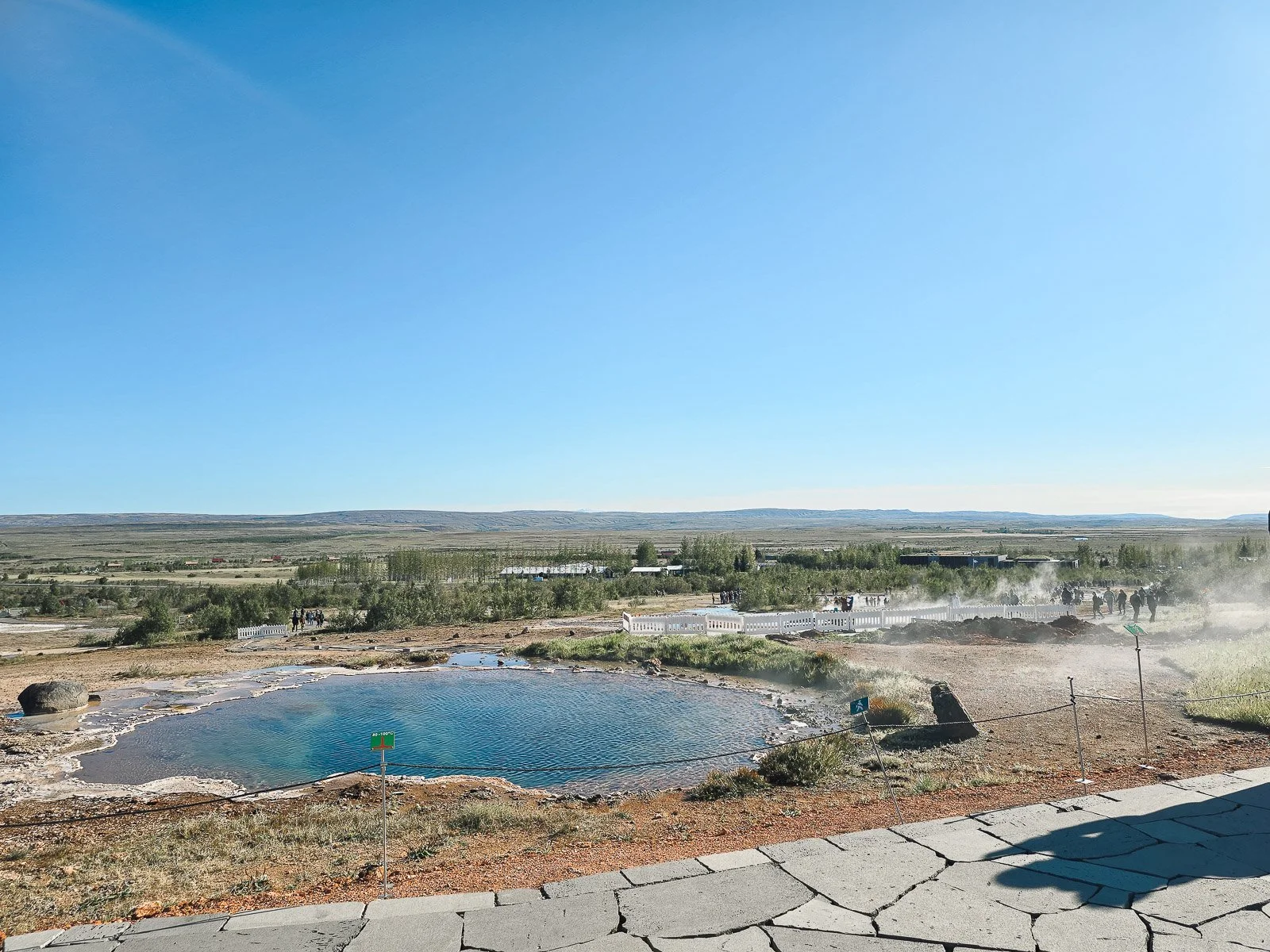 Geothermal pool and steaming landscape at the Geysir Geothermal Area in Iceland