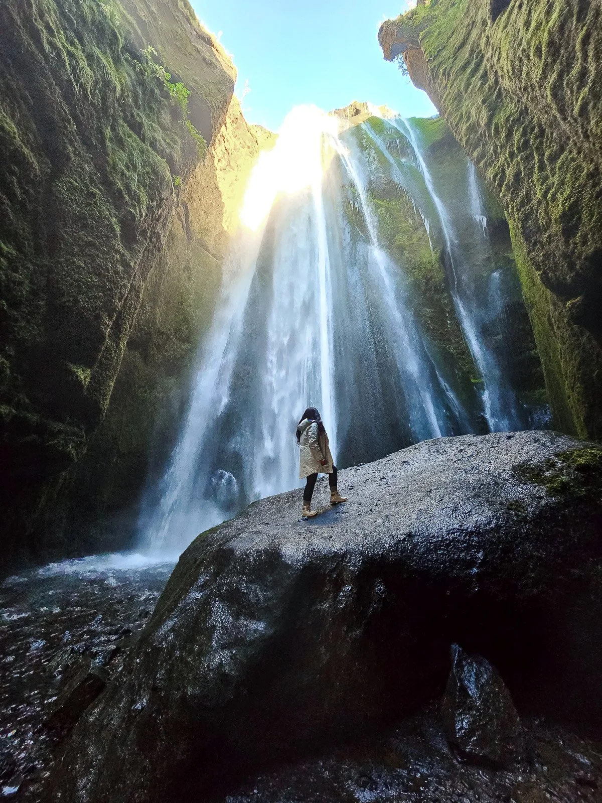 Gljúfrabúi waterfall inside a narrow moss-covered canyon in Iceland