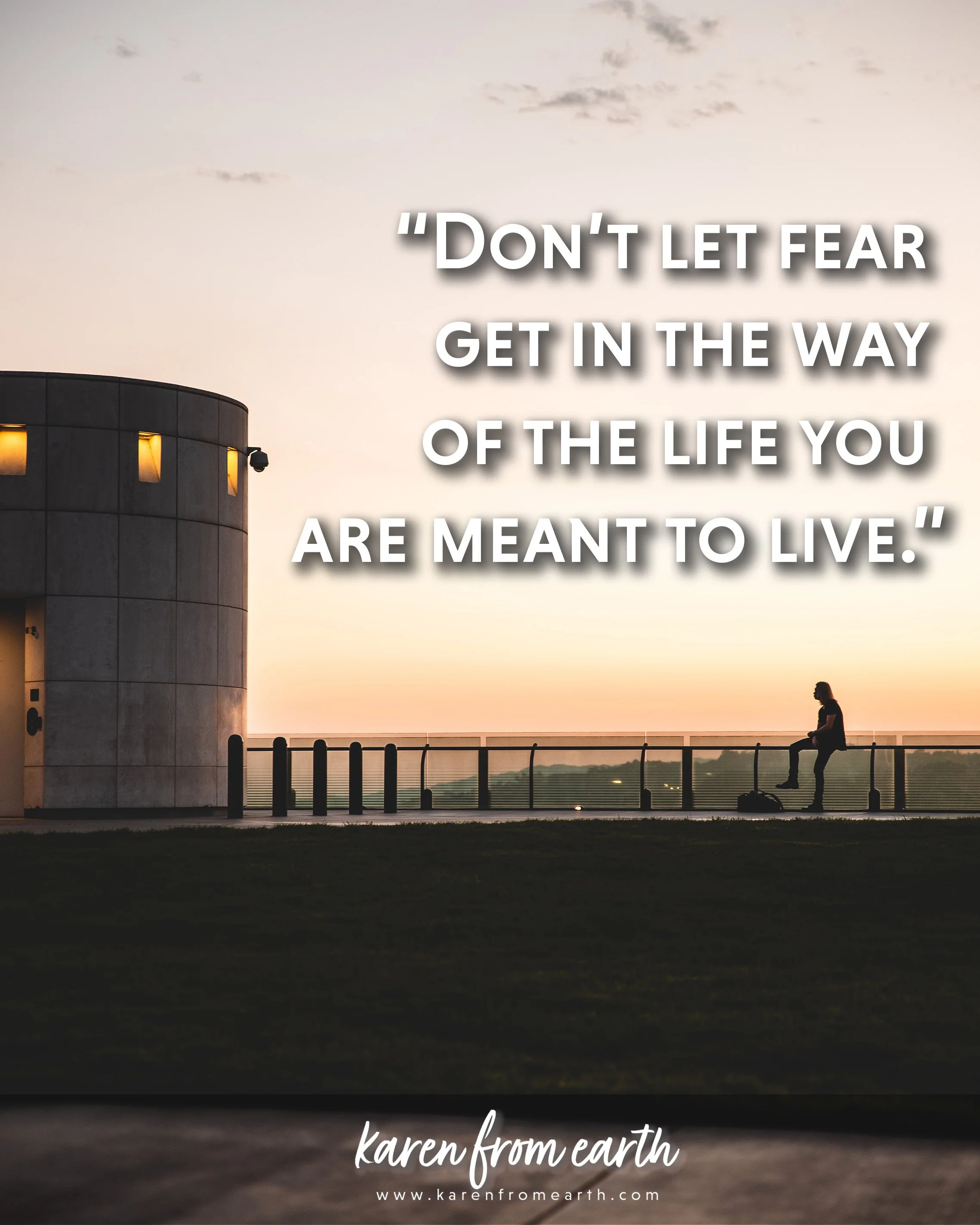 Inspirational quote about overcoming fear over a photograph of a lone person standing beside a waterfront railing at sunset.