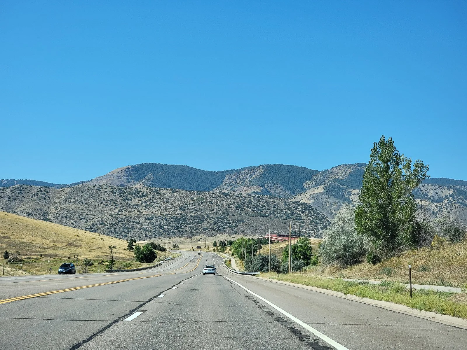 Road leading toward the mountains outside Denver, Colorado
