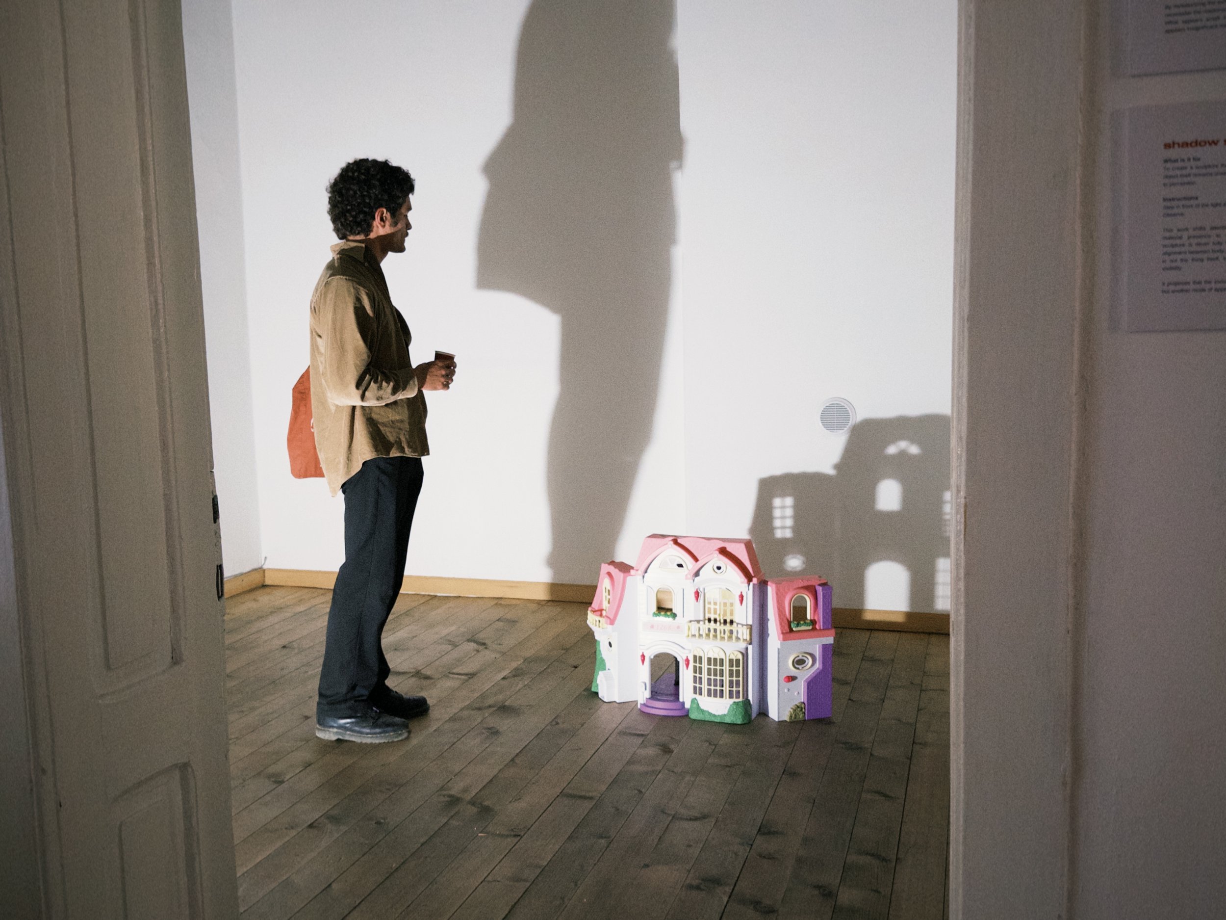 SHADOW SCULPTURE (left) - To create a sculpture that exists only as a shadow. The object itself remains unseen; only its projection is available to perception.
DOLL HOUSE (right) - A reflection on the exhibition space as a medium in itself. The remai