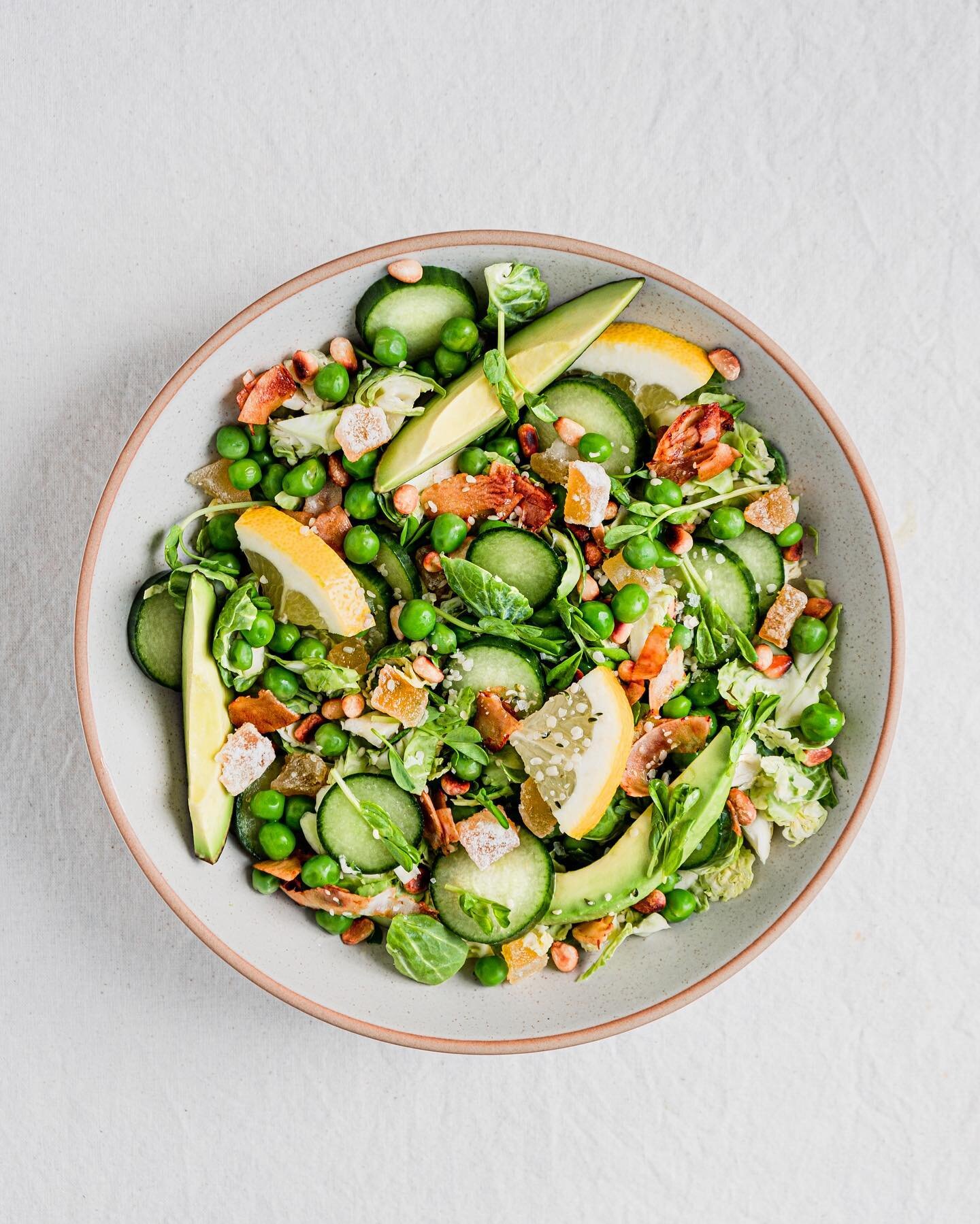 What&rsquo;s greater than the sum of its parts? This shaved Brussels sprouts salad with fresh peas, crisp cucumber, creamy avocado, salty coconut bacon toasted pine nuts, all dressed in a ginger lemon herb vinaigrette.

Which ingredient is a nonnegot
