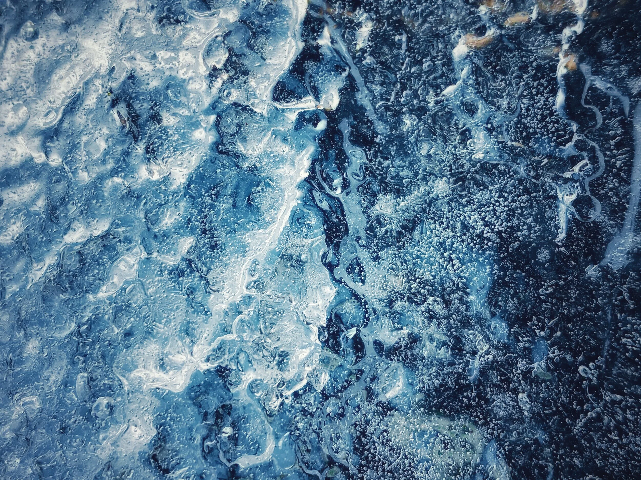 I recently watched Jimmy Chin's documentary Meru and this reminds me of an arial shot of a mountain range. It's ice on a post in my yard. Not as dramatic, but also a lot easier of a shot to get. ;)