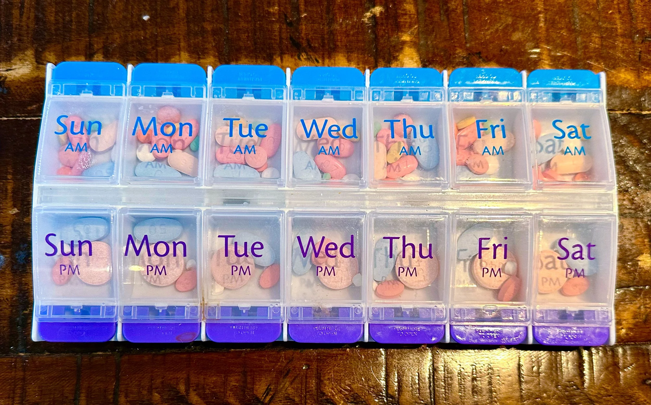 Weekly pills sorted.
Worry and hope in each box.
Empty boxes? Joy!