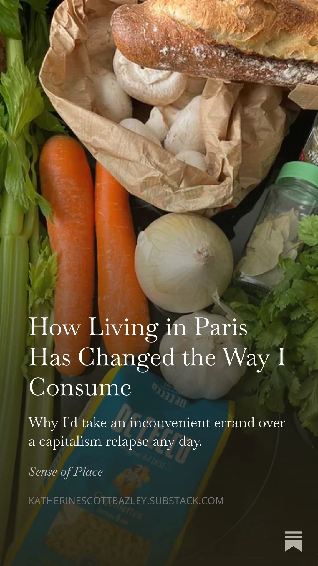 Fresh vegetables including carrots, onions, celery, and mushrooms on a kitchen counter with a loaf of bread in a paper bag and a jar of herbs.