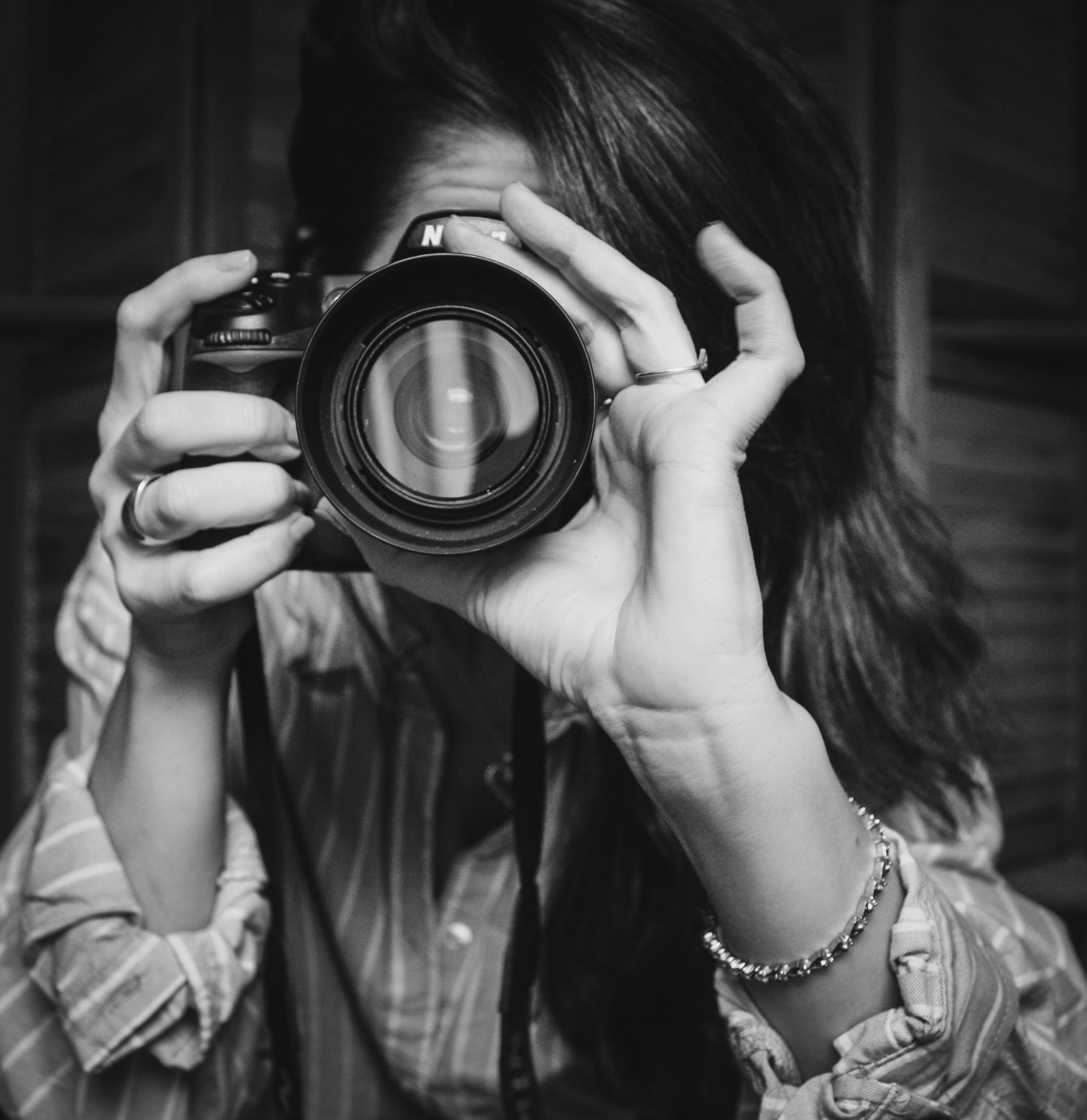 Self portrait Photo on Pleshaw.com of Owner Mandy Pleshaw taking a photo on Nikon