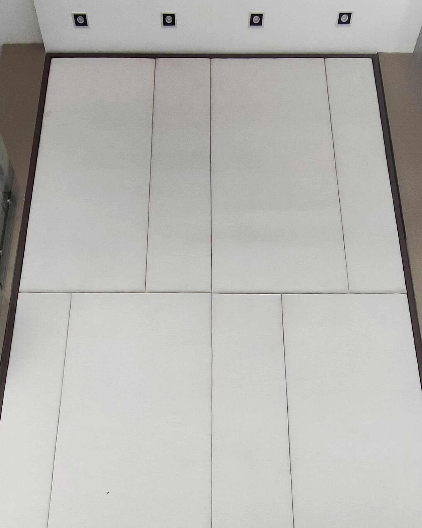These are upholstered wall panels. It took the supplier three tries to finalize the quality and get our approval. The supplier adjusted the stretch to achieve a uniform appearance of the fabric, especially on the beveled edges and corners. The second