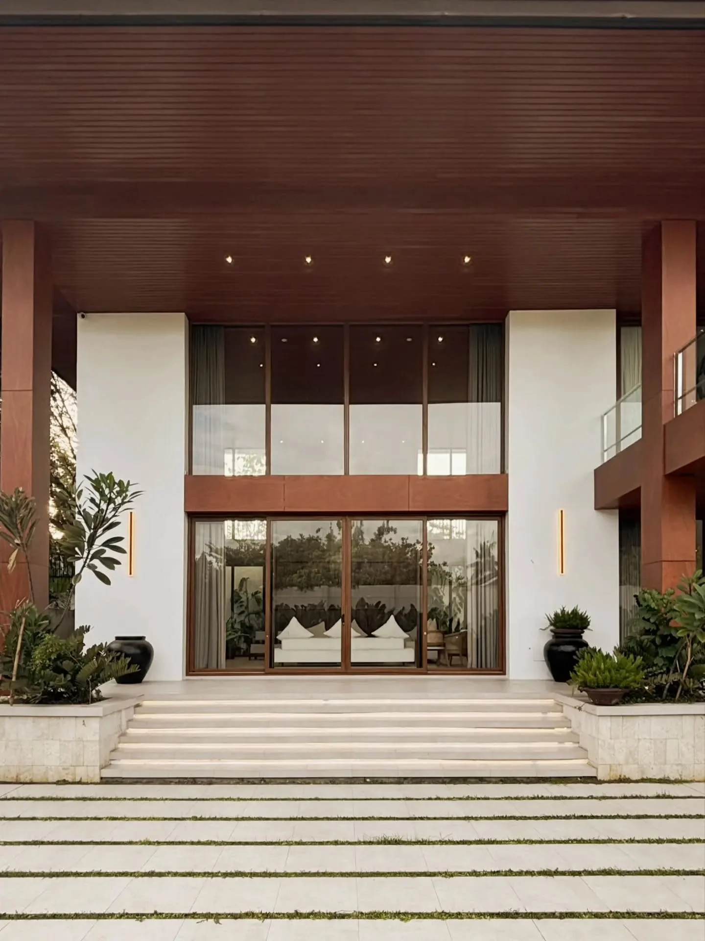 The approach, the steps, the framed view beyond the entrance. Each element prepares us to leave the outside world behind and enter a quieter space.

Good architecture creates a sense of arrival. As we enter, the noise of the outside world begins to f