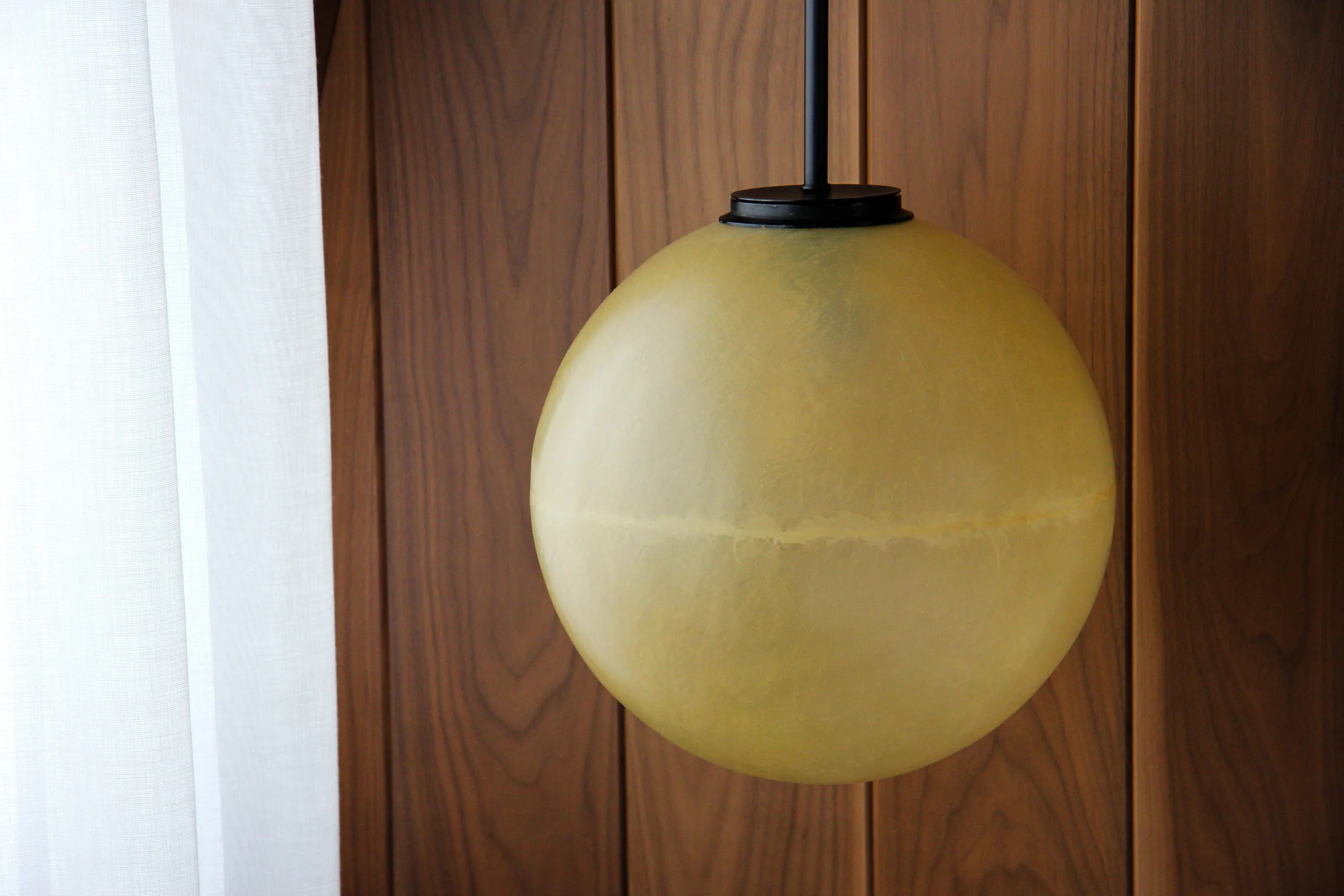 Planet-like lamps hanging from the roof.