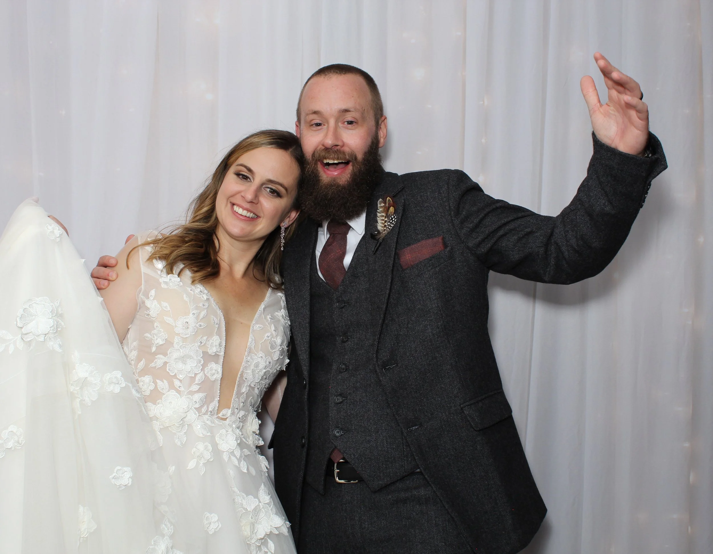 A photo booth strip featuring a bride and groom posing with a 'Happily Married' sign in front of a leafy backdrop. They are smiling in the first and third photos and kissing in the second photo. The bottom of the strip includes text: "This Will Be an Everlasting Love... Lee & Matt, September 3, 2021," with floral decorations.