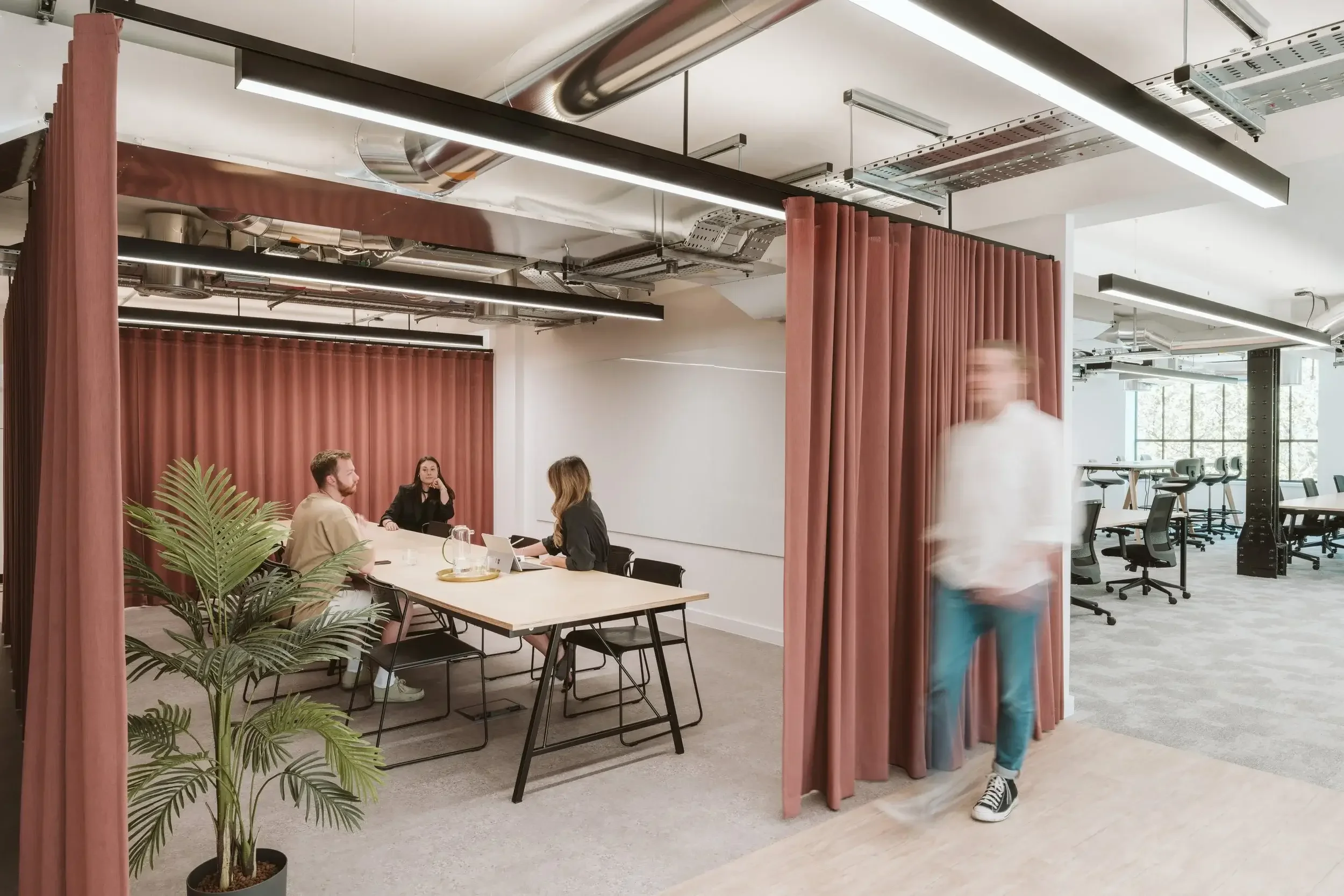 Open meeting space with pink curtains