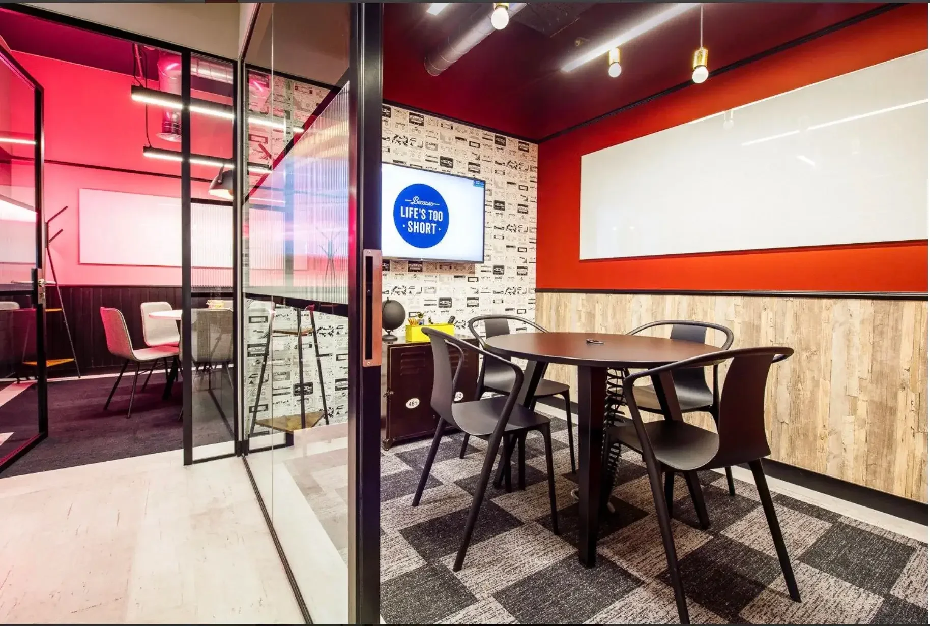 Two glass whiteboards in two meeting rooms