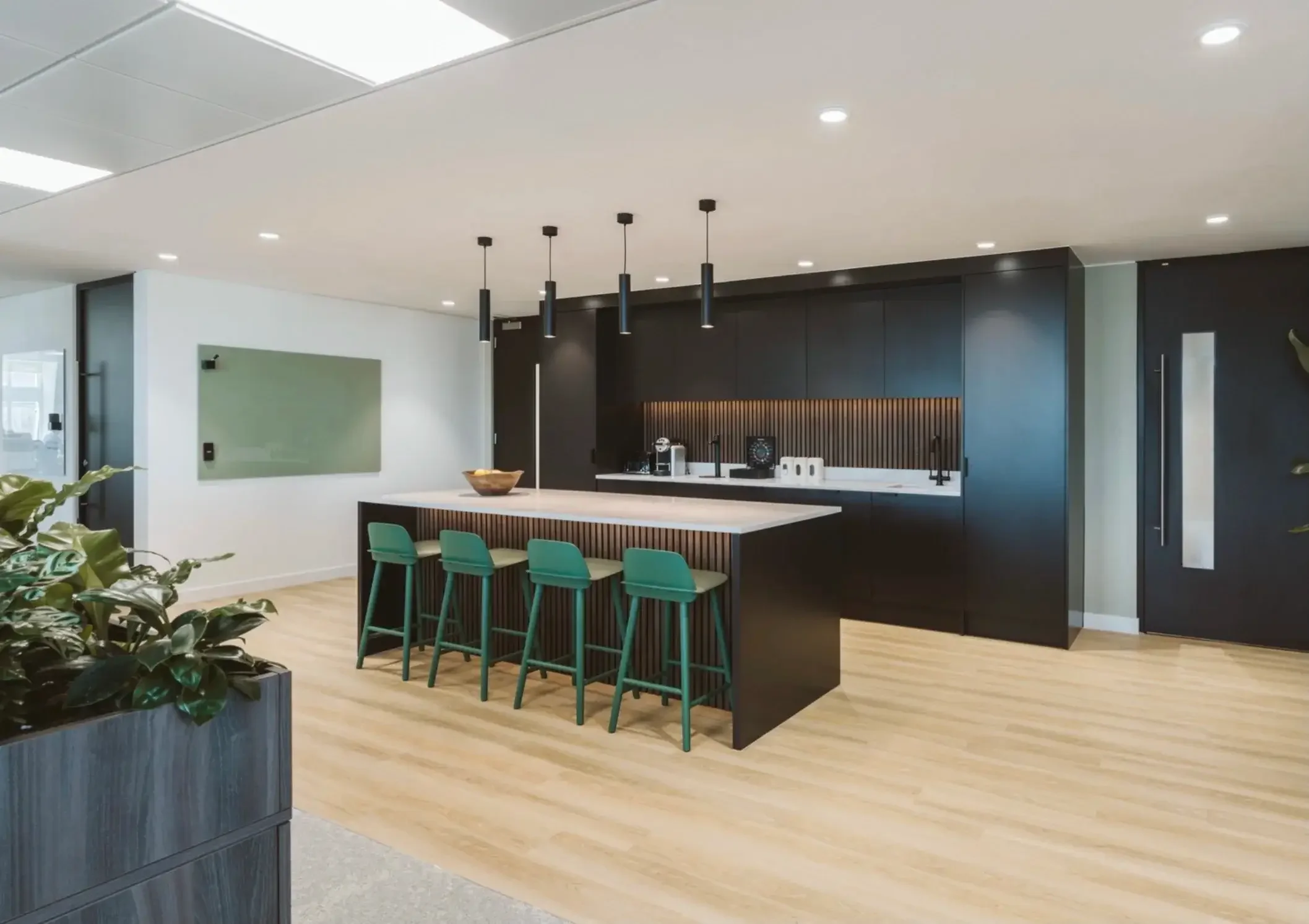 Black office kitchen with glass whiteboard (1).webp