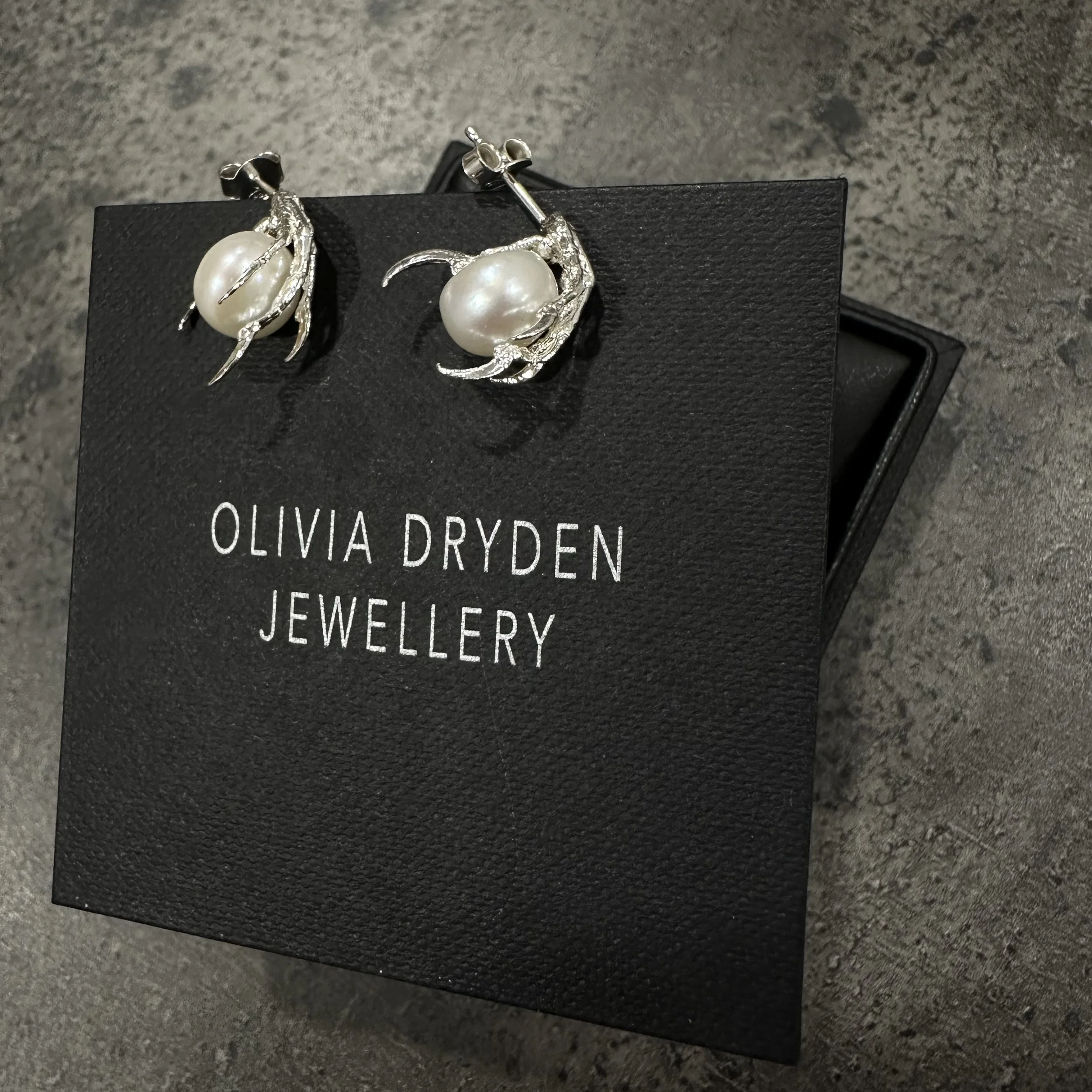 Bird Claws Clutching Pearls Stud Earrings.jpeg