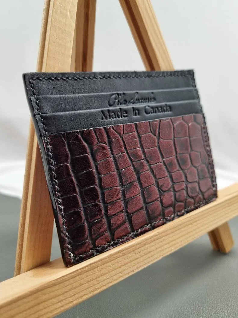 Angled view of a luxury alligator leather card holder, made by Pila Luxuria in Canada.