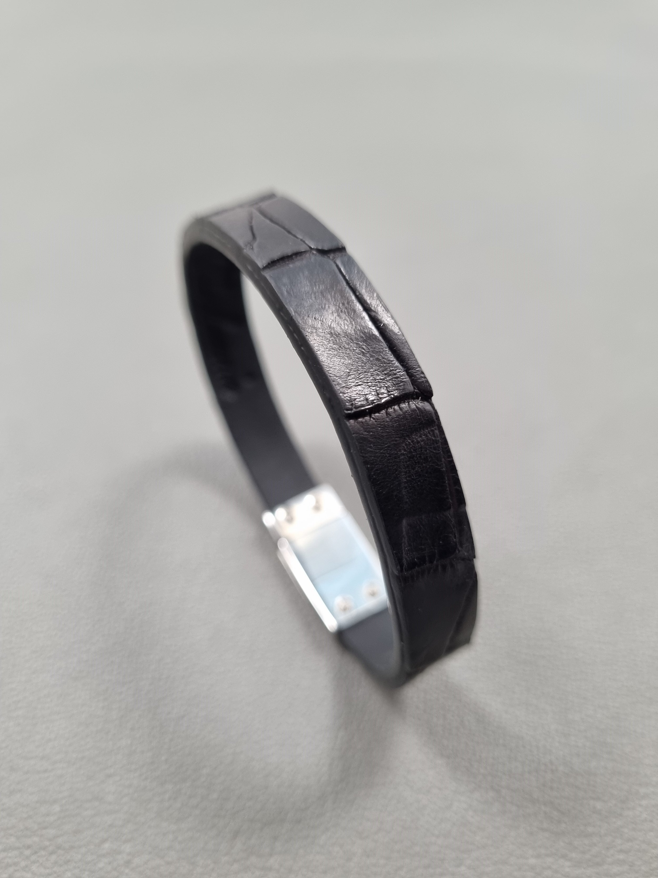 Black crocodile leather bracelet with black calfskin lining.